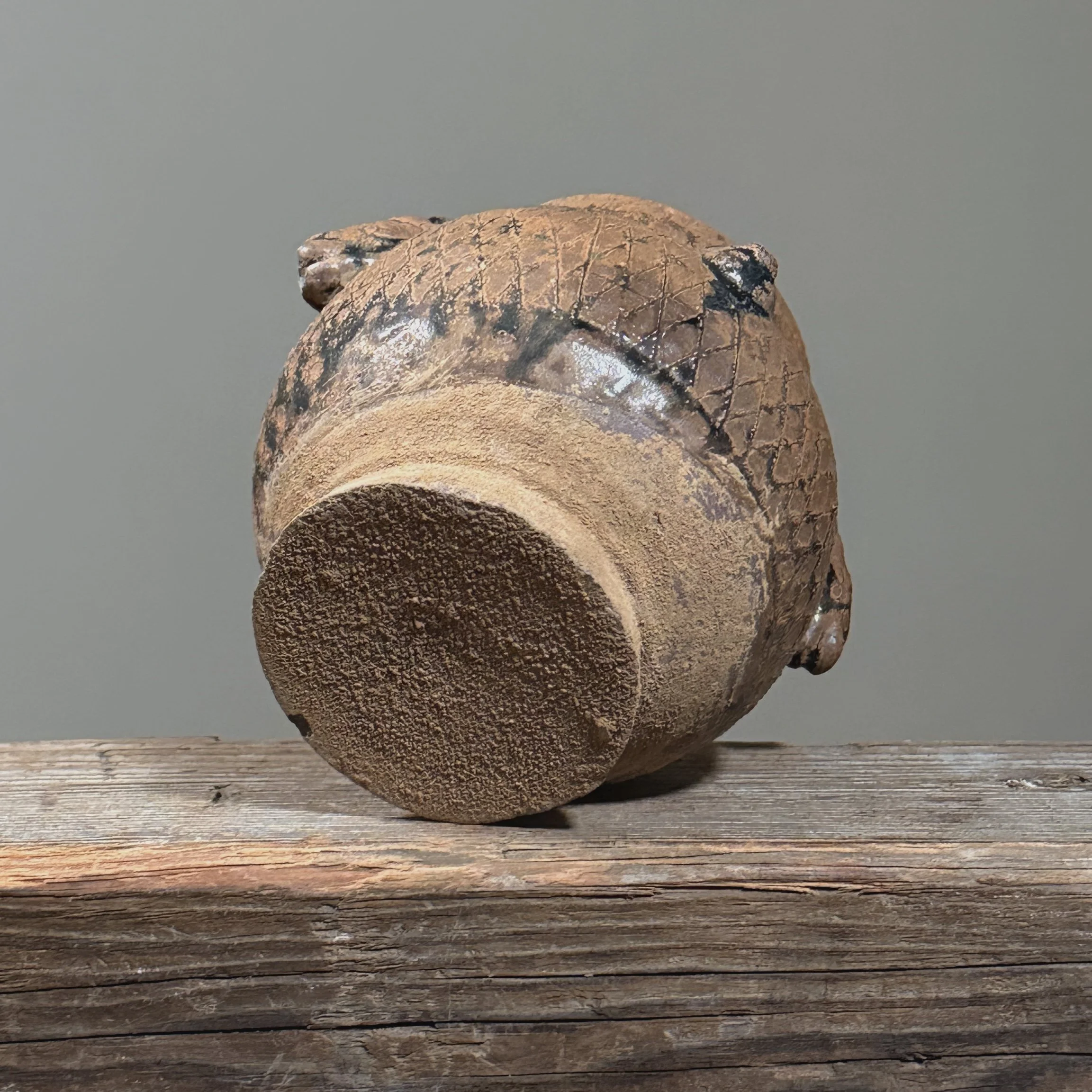 View of the jar's base, showing the foot and unglazed firing surface.