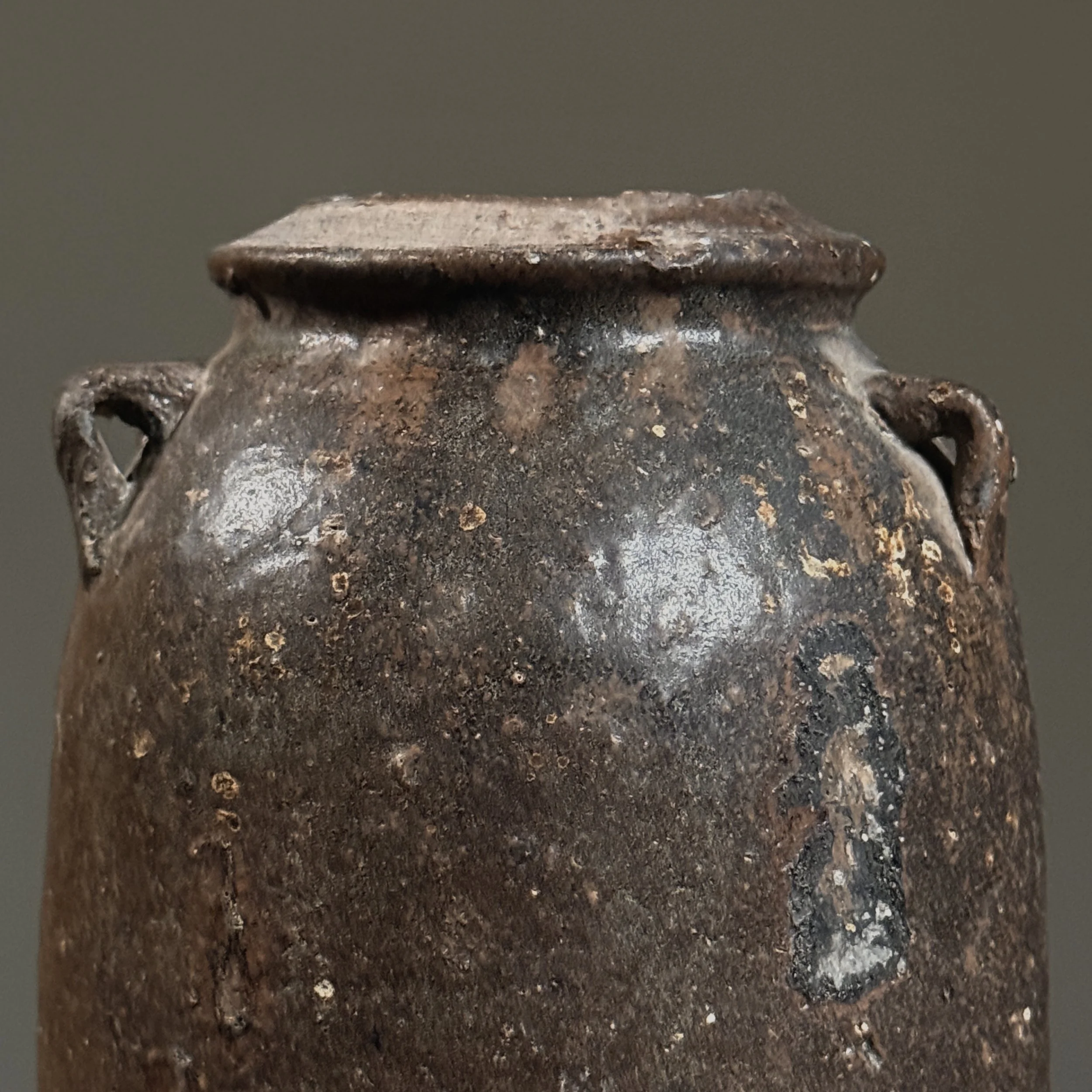 Detail of the brown glaze surface and subtle variations in color and texture.