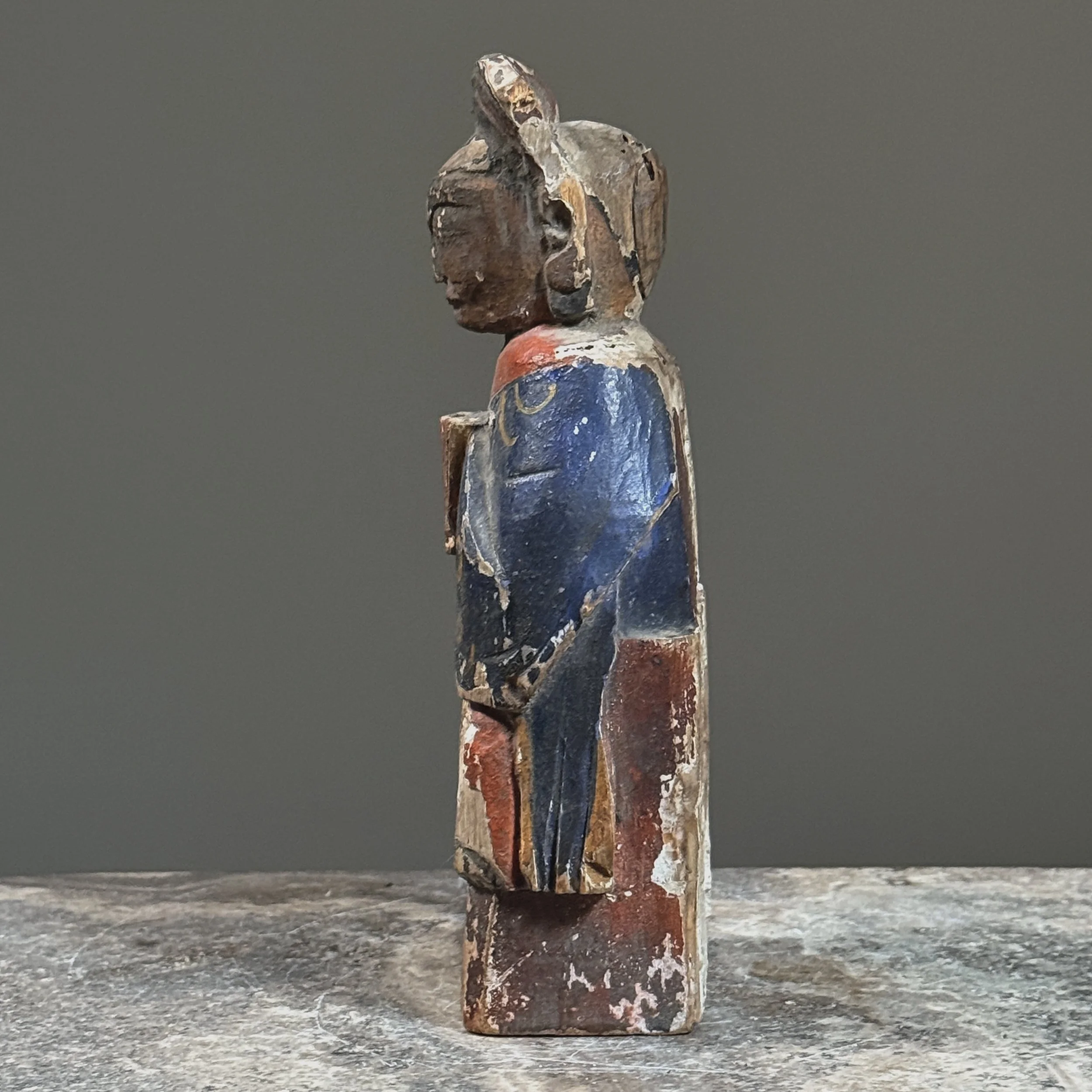 Side profile showing the figure's proportions and depth.