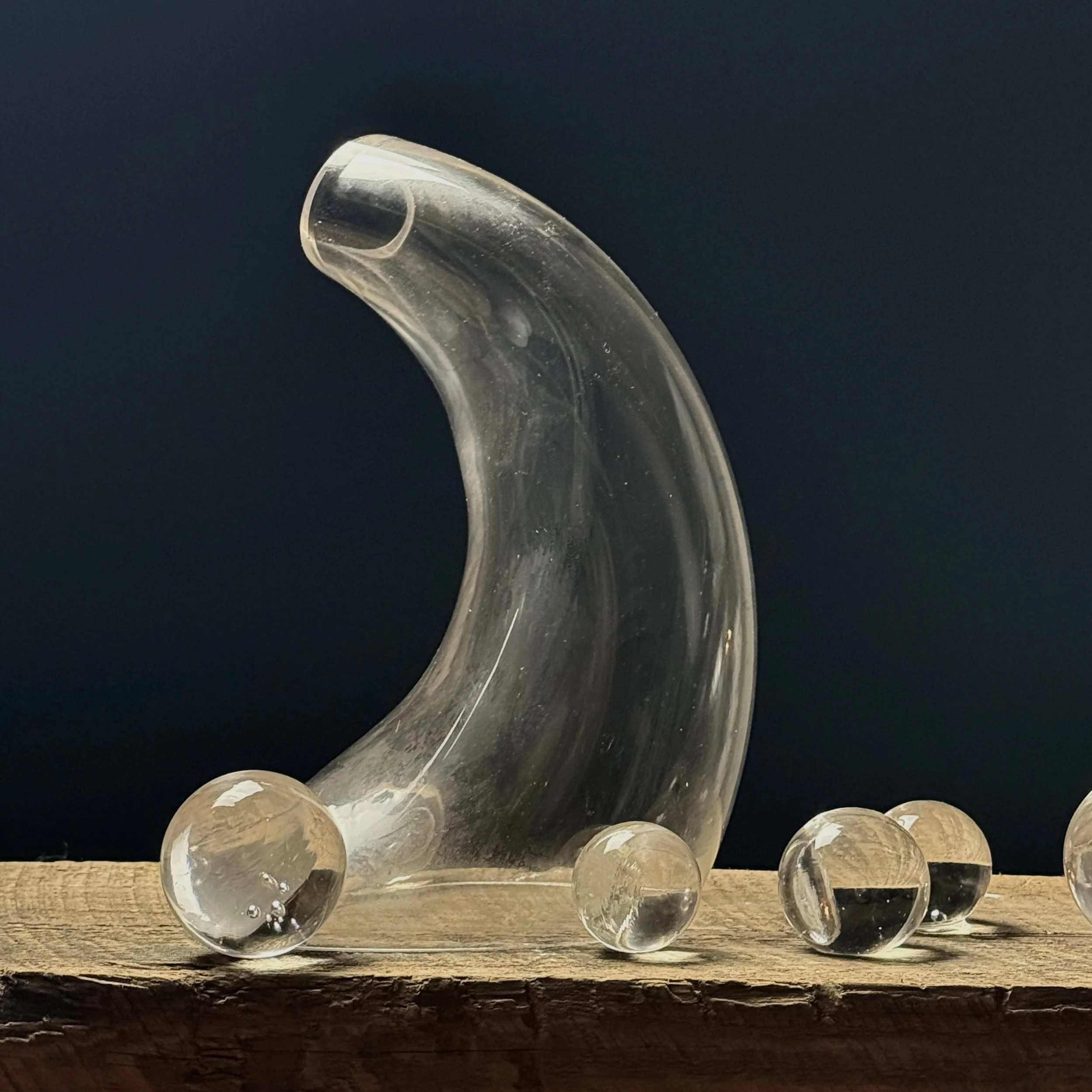Medium glass sculpture with curved biomorphic shape and subtle opacity shifts