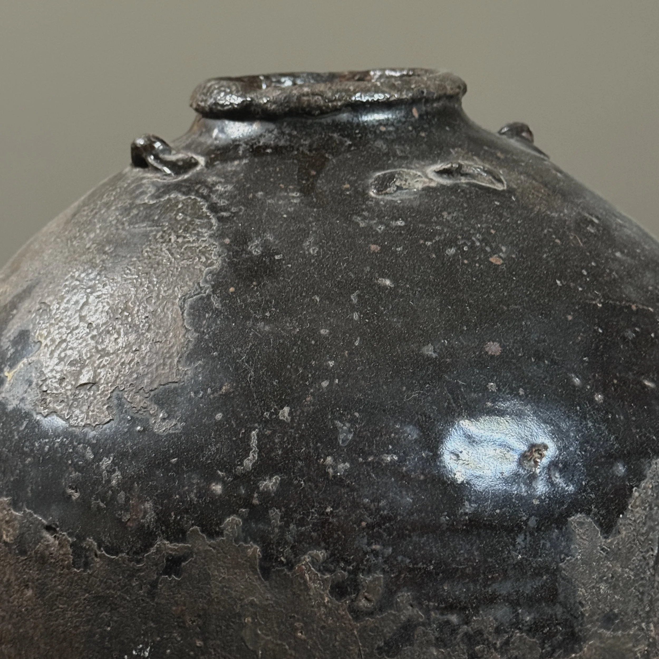 Detail of glaze texture and patina on 17th century vessel