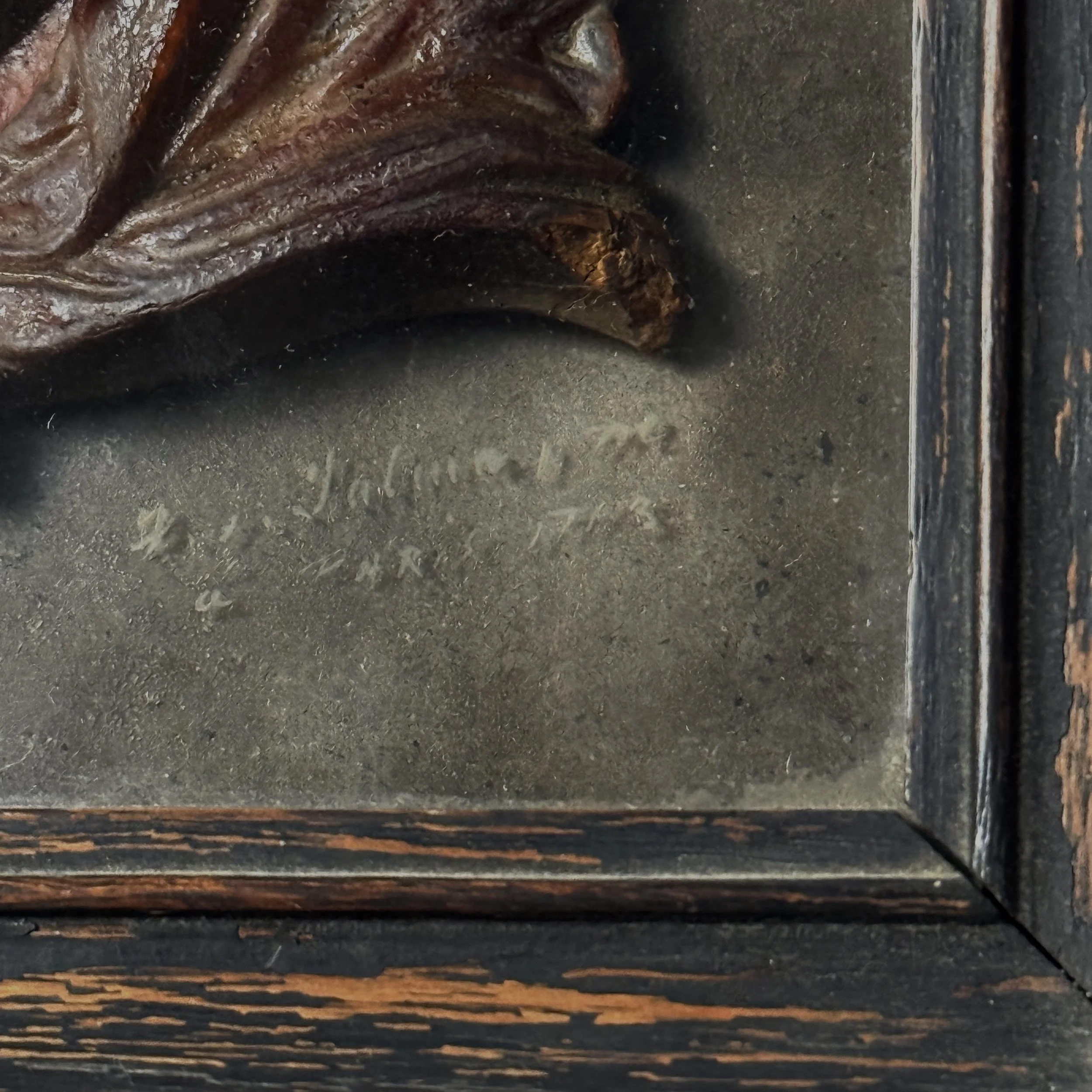 Close-up of signature on back board of antique French wax profile, signed lower right, dated 1761 Paris