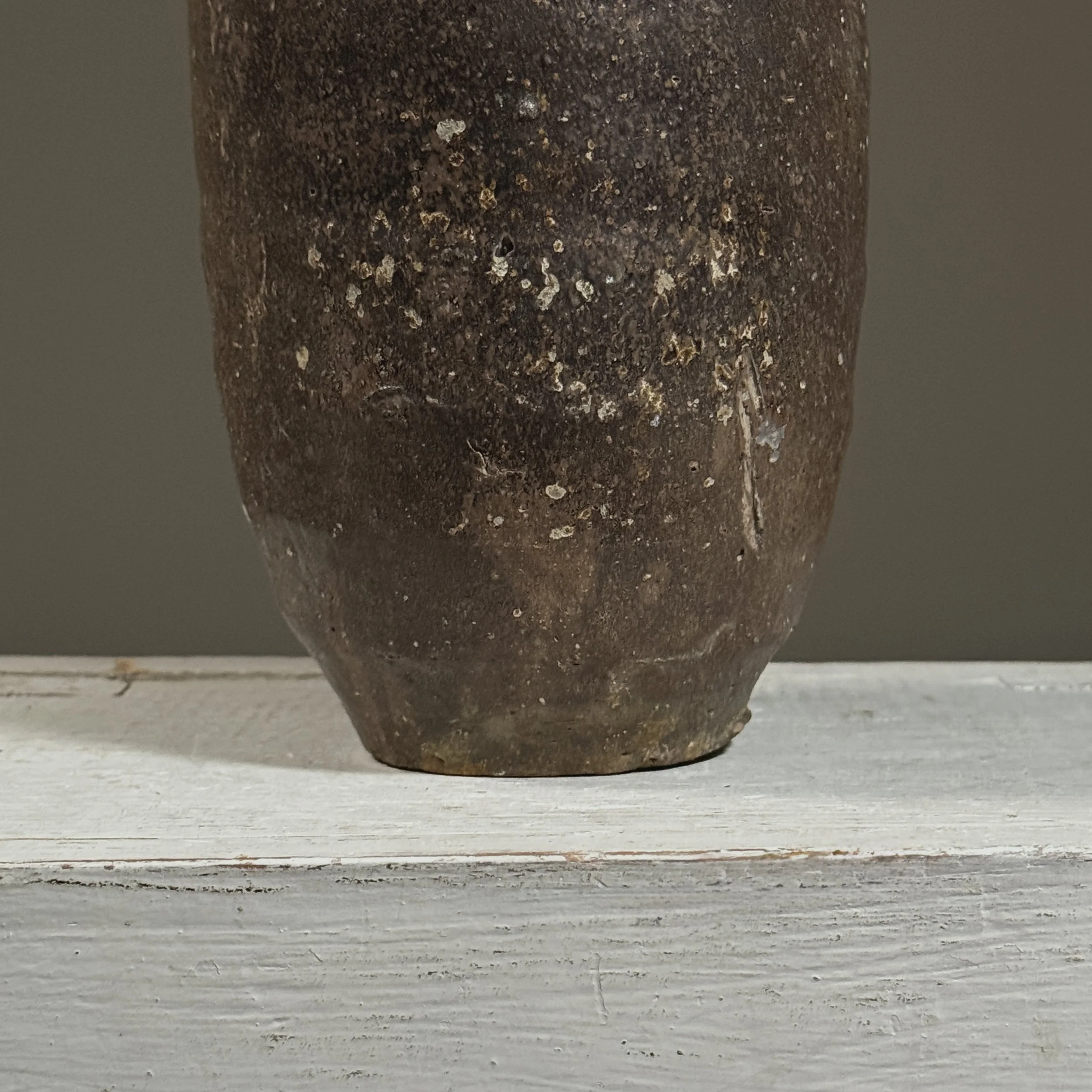 Detail of the brown glaze surface and subtle variations in color and texture.