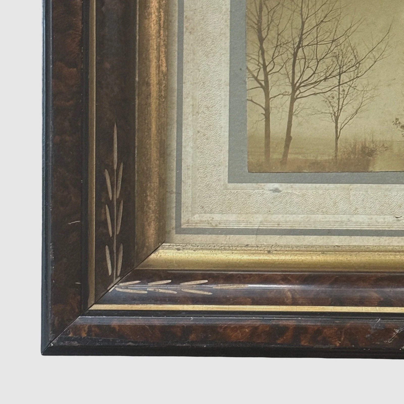 Victorian frame detail. Carved ornamentation. Faux marbling finish.