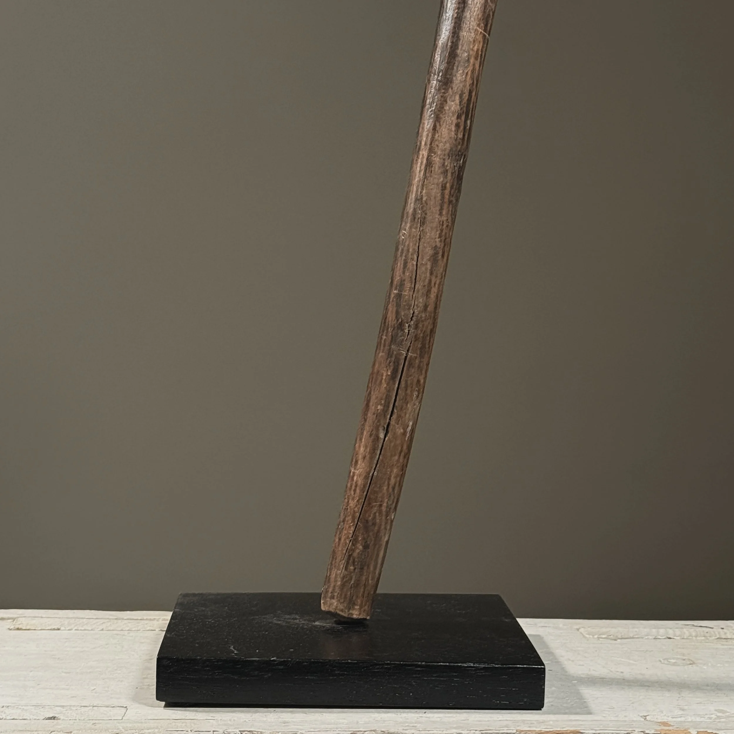 The axe mounted on its custom stand