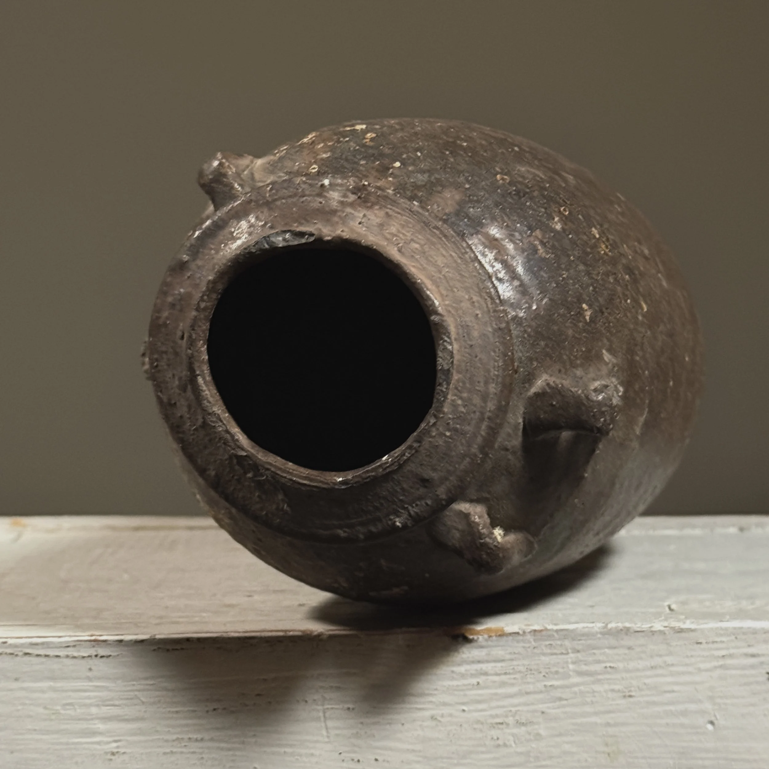 Top-down view of the jar's mouth and interior glaze.
