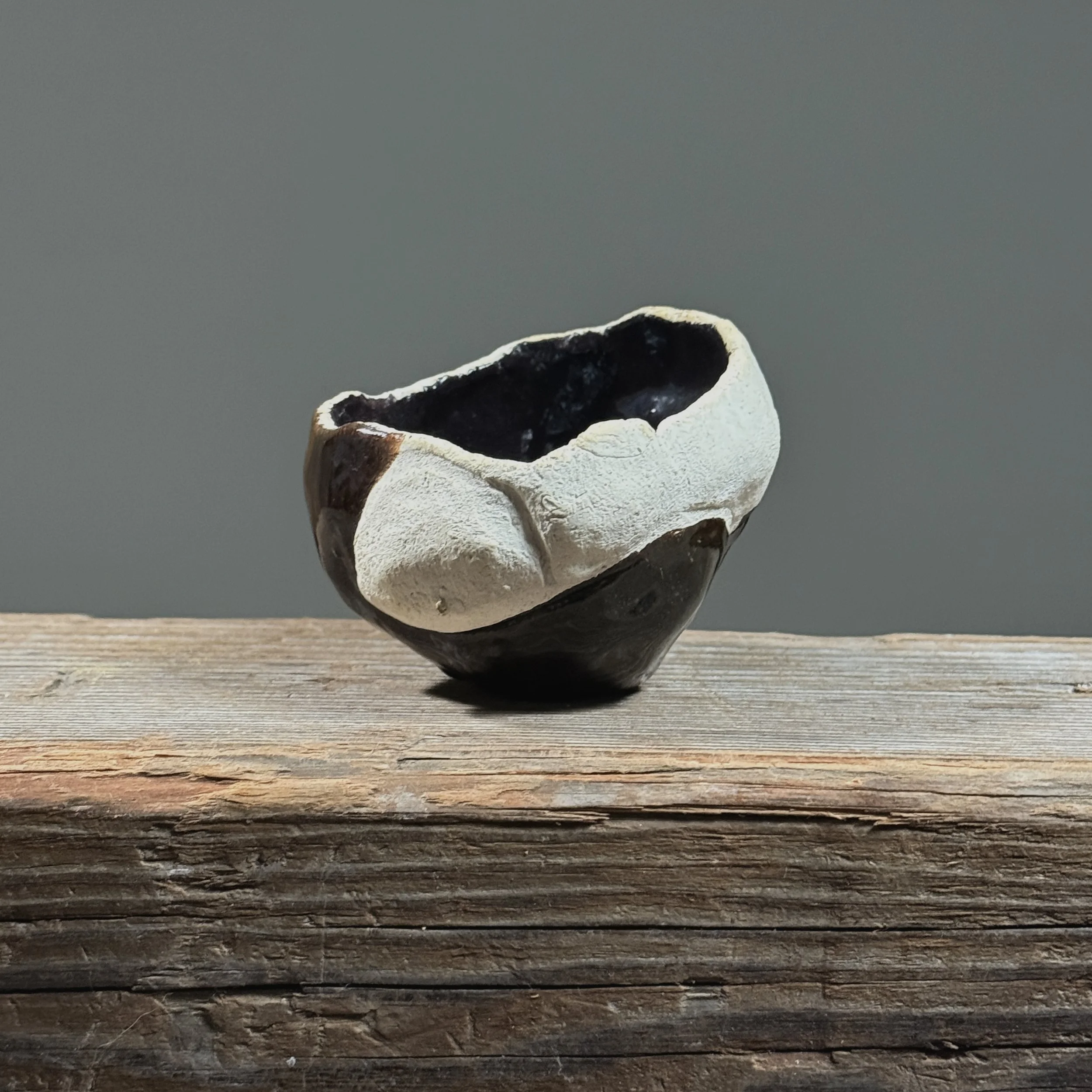 Glossy black vessel. Smooth finish. Modernist silhouette.