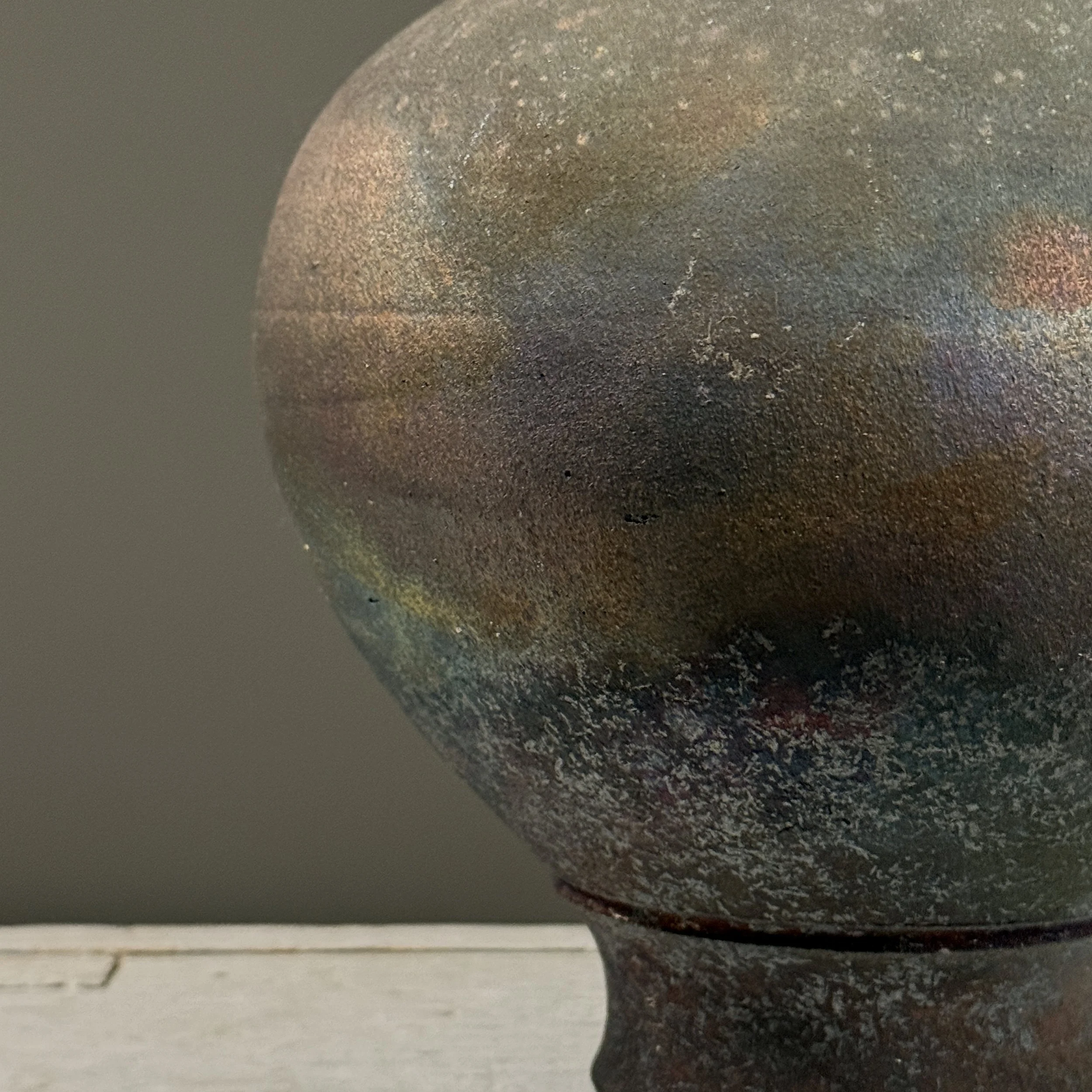 Surface detail. Iridescent variations across exterior.
