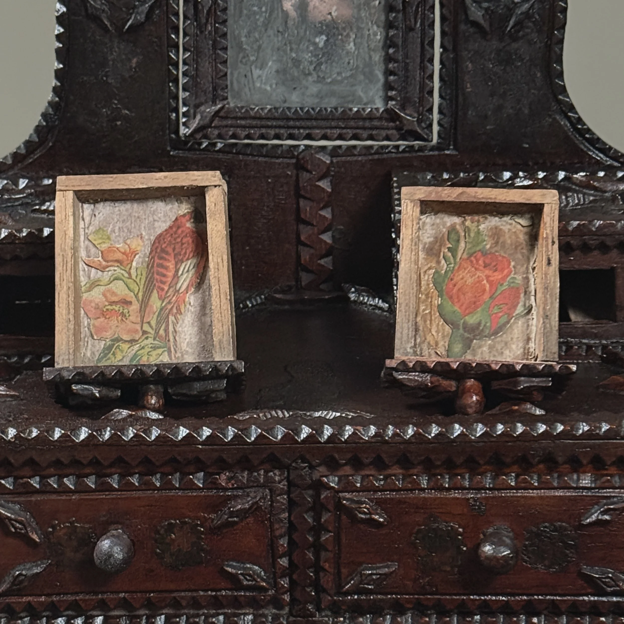 Interior view of small top drawer showing Victorian decoupage lining