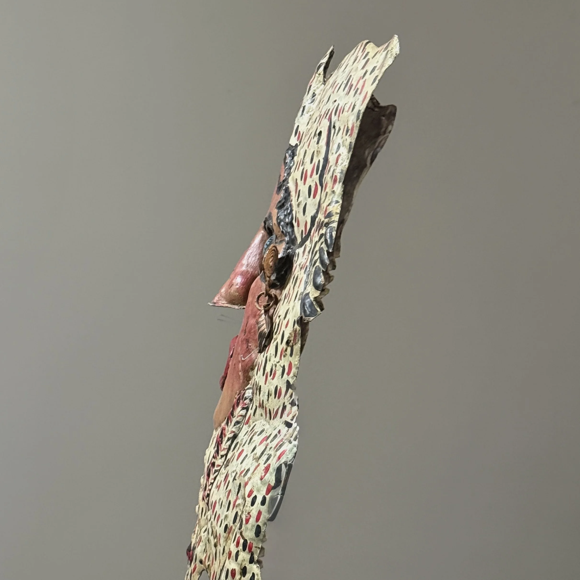 Side view of polychrome Guerrero folk art mask