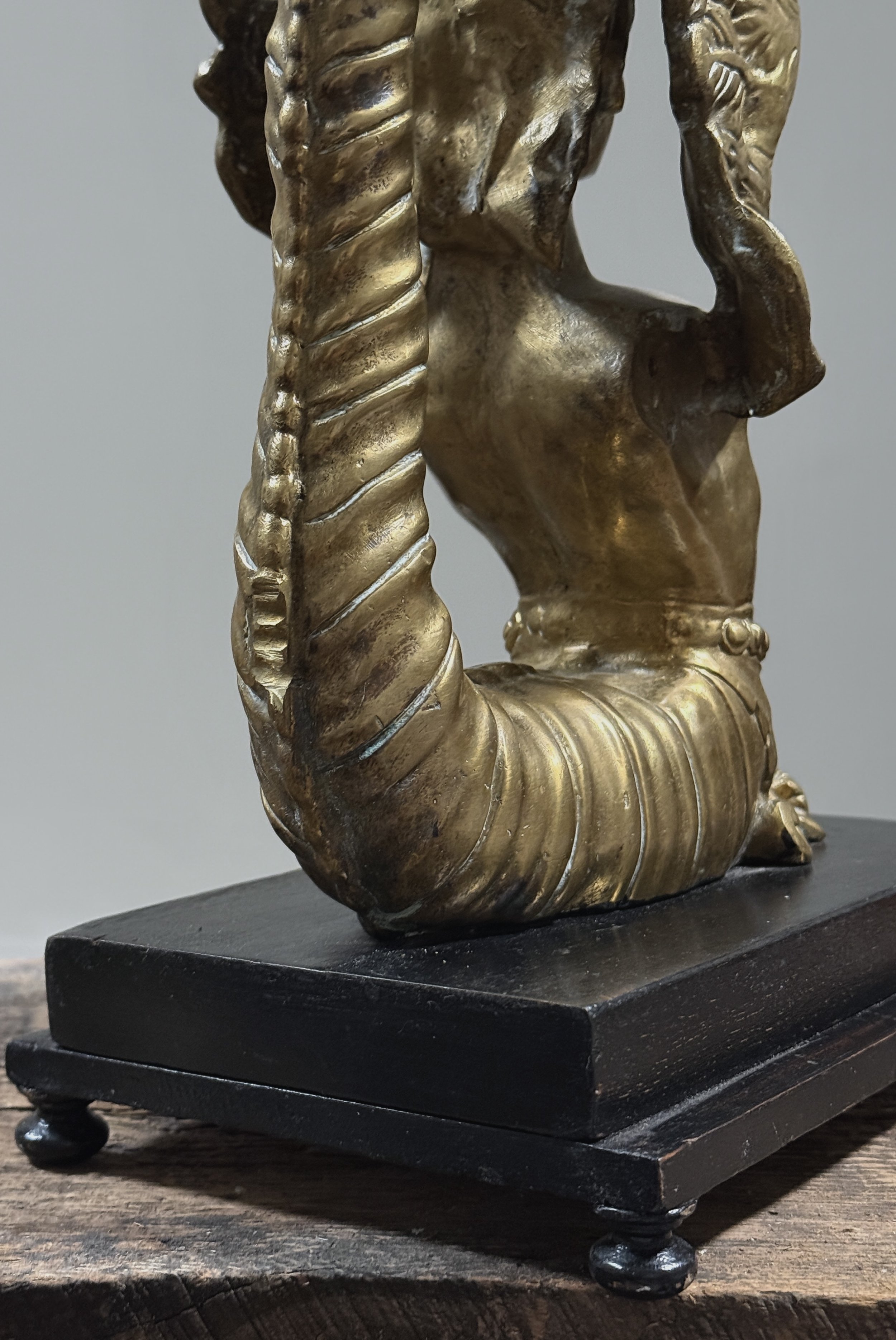 Detail view, pair of brass Melusine sculptures, Neoclassical style