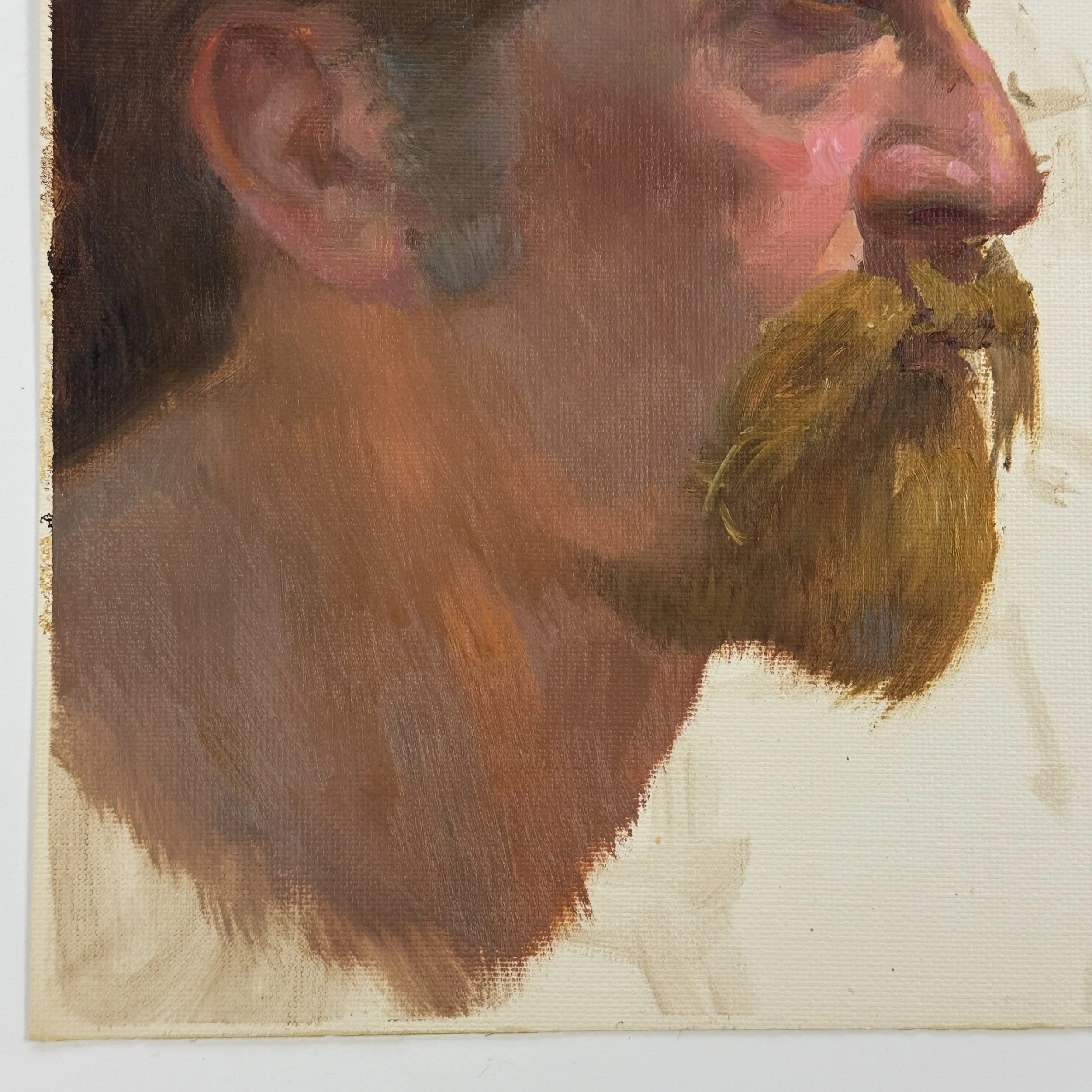 Close-up of bearded man’s face in oil on canvas paper portrait