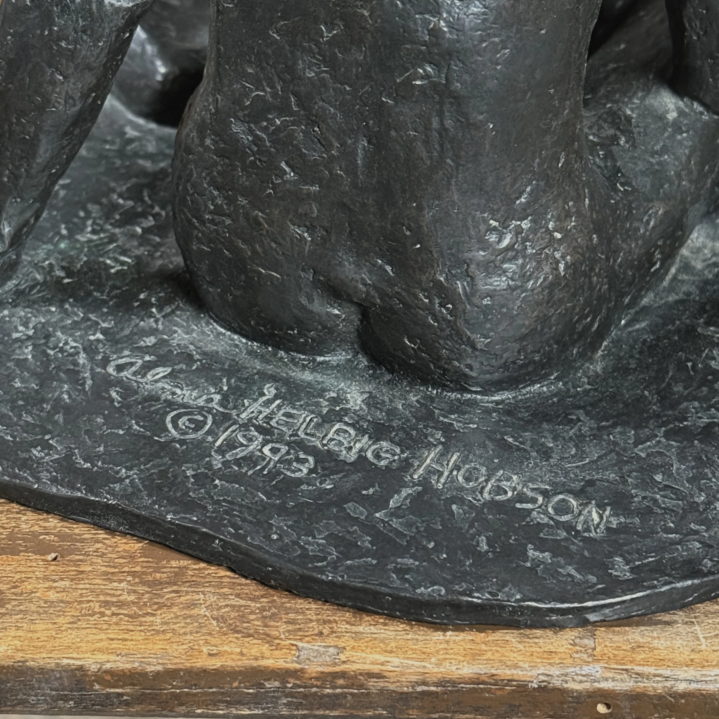 Platform detail. Artist signature etched into bronze platform.