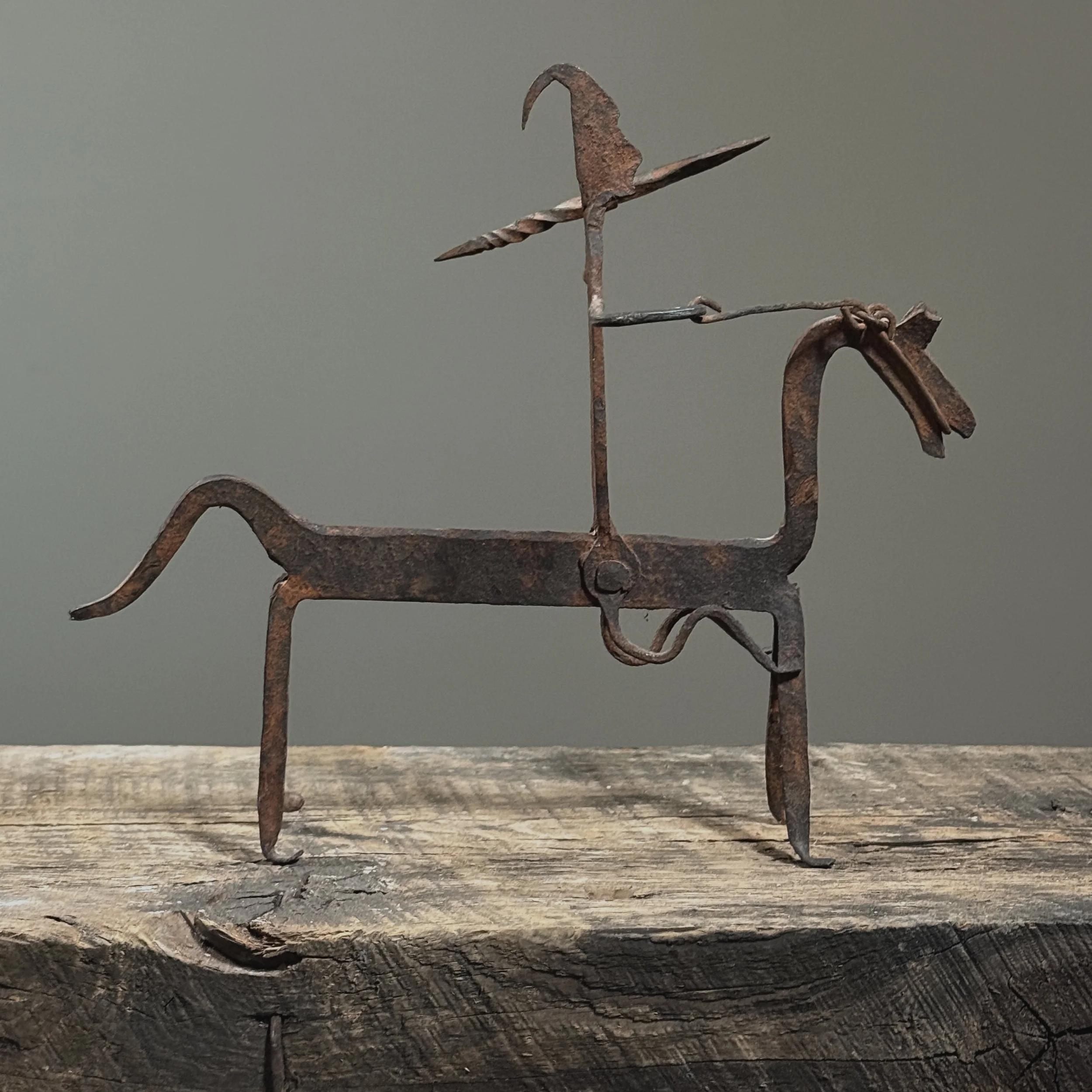 Traditional Dogon metalwork depicting horse and rider, side view