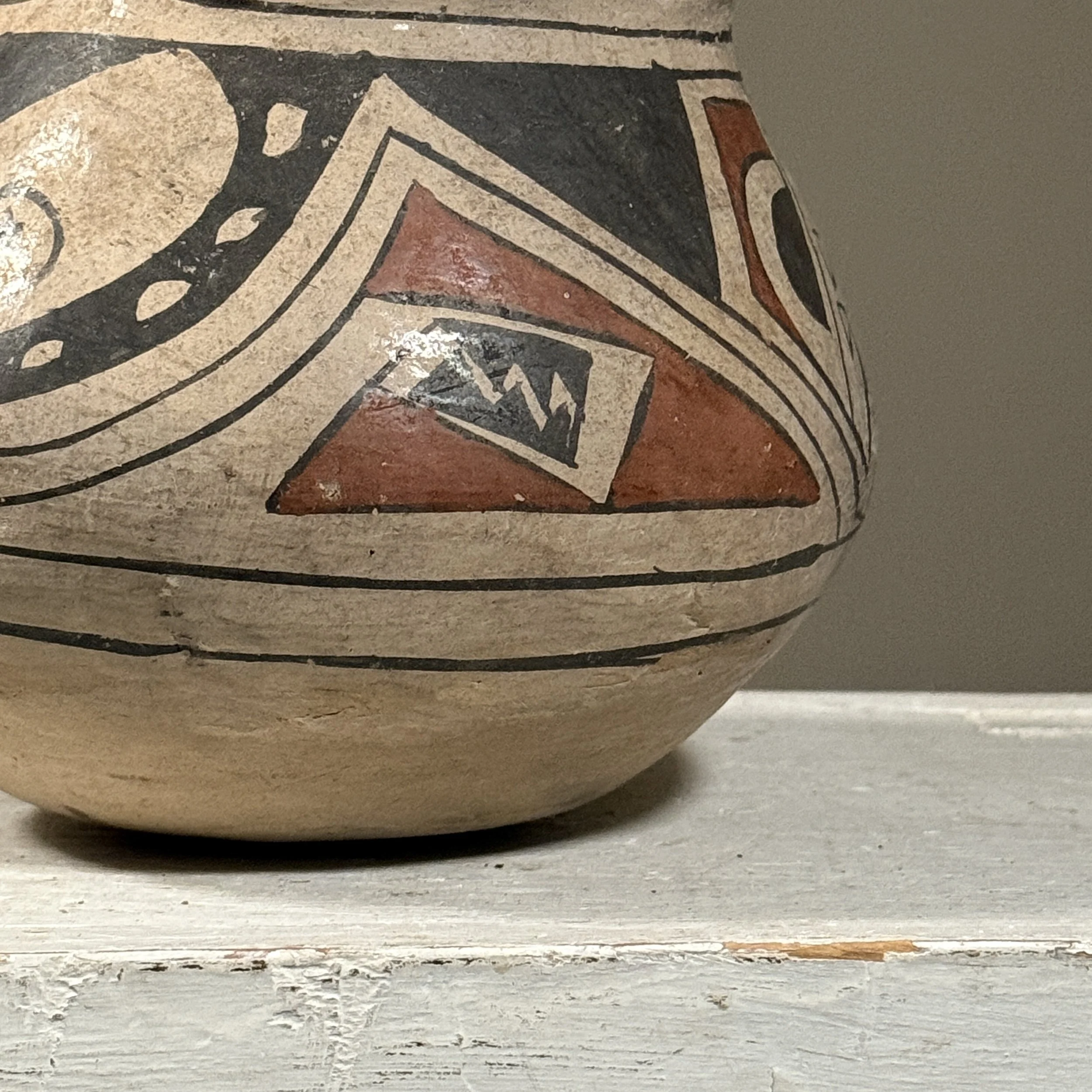 Painted geometric patterns on effigy vessel