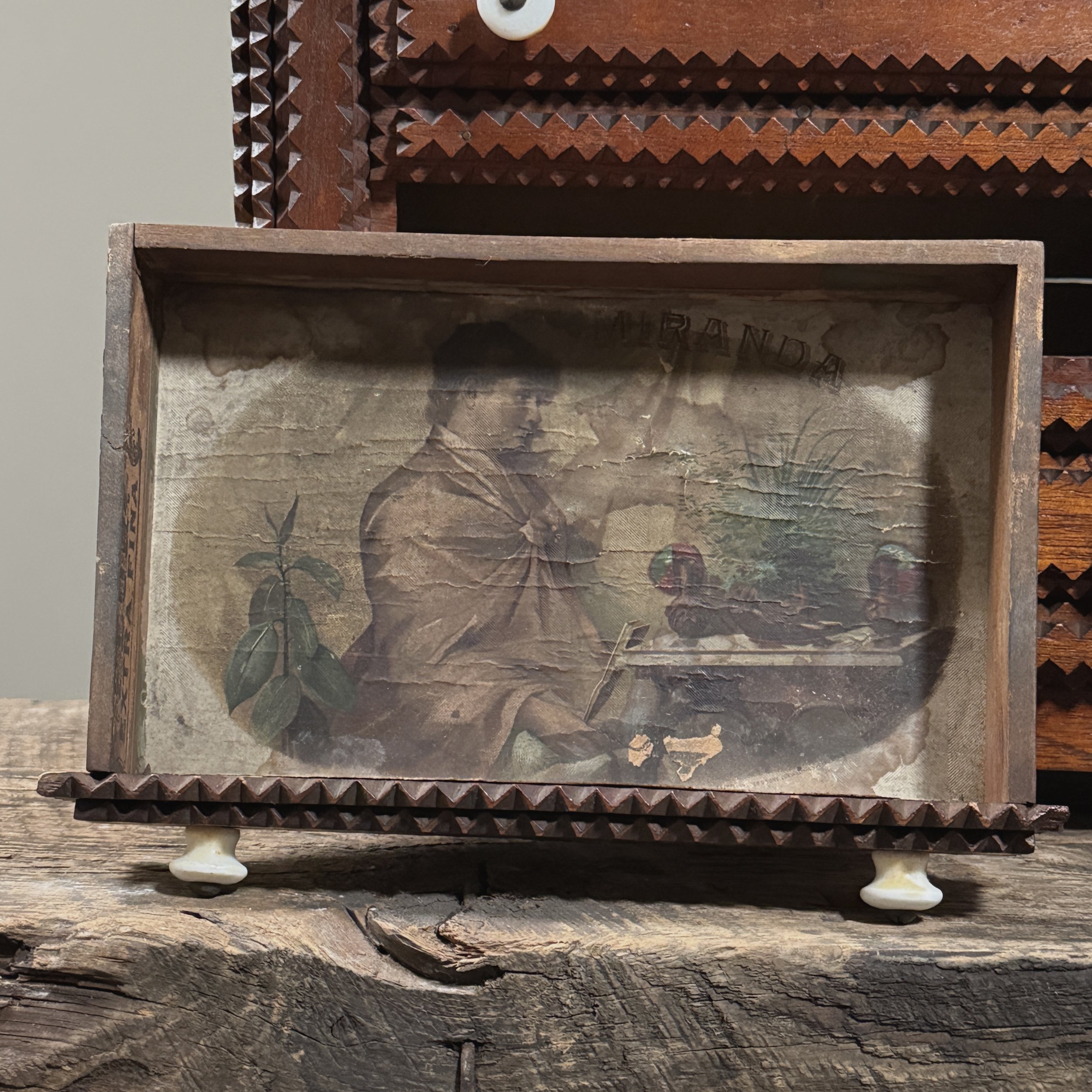 Open drawer showing the original vintage cigar box paper lining.