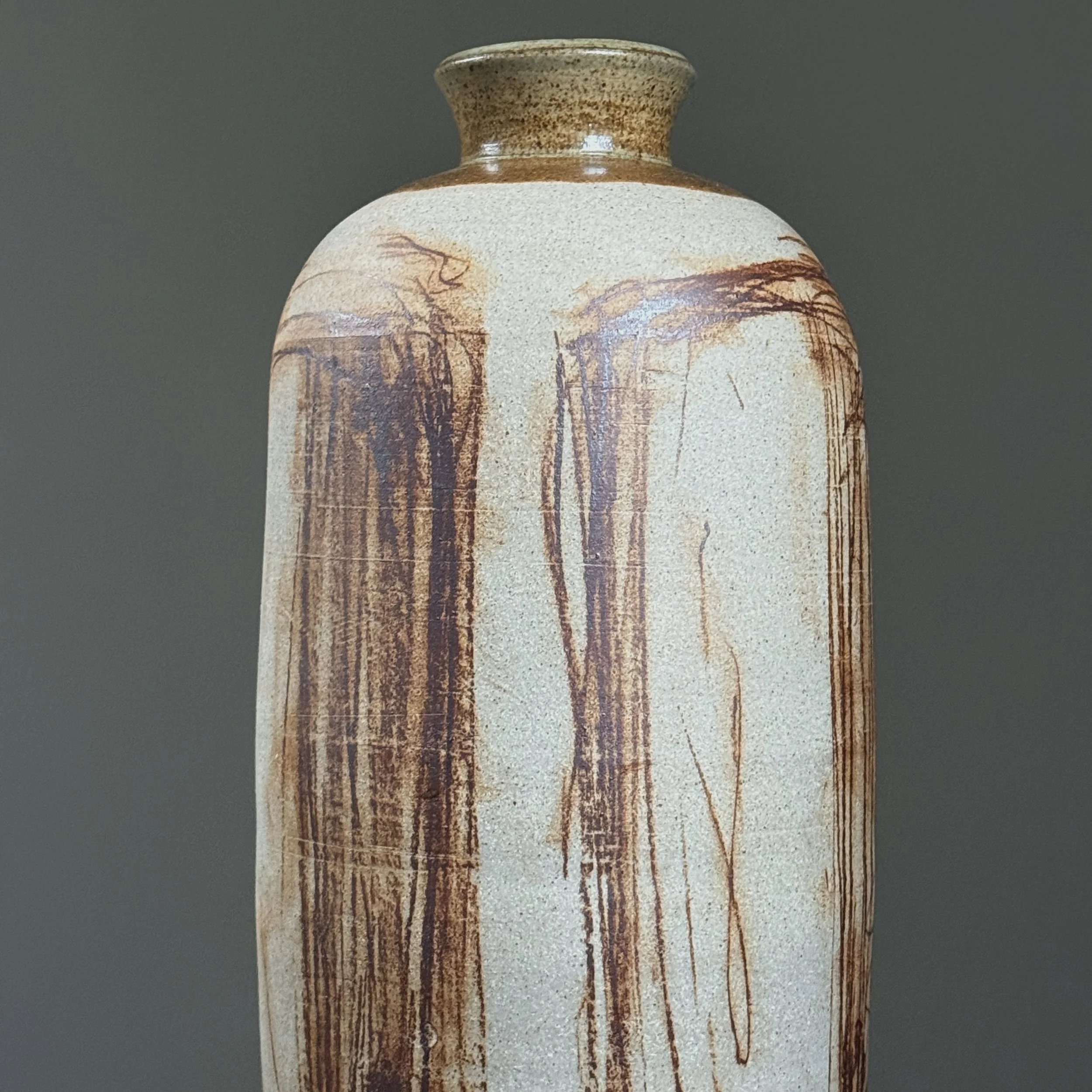 Textured matte beige earthenware with abstract design