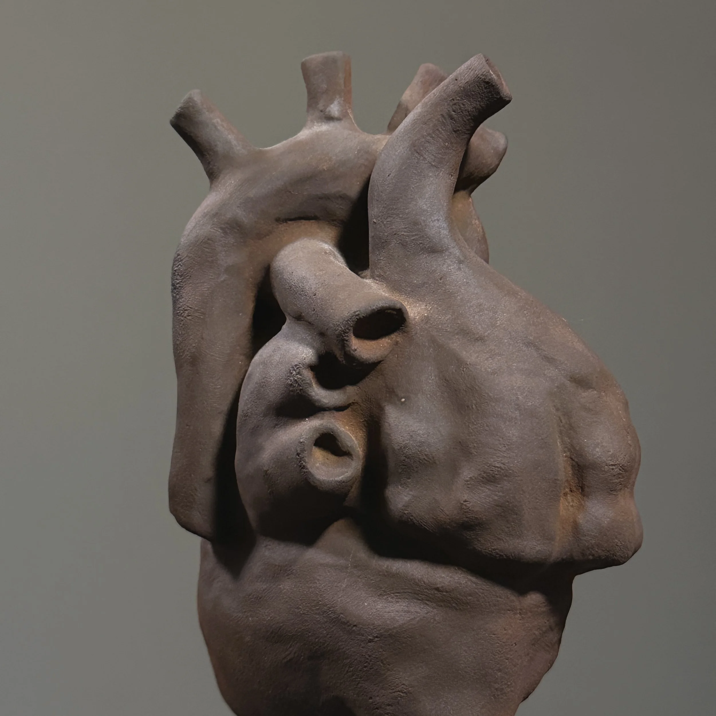 Close-up of dark brown ceramic heart form