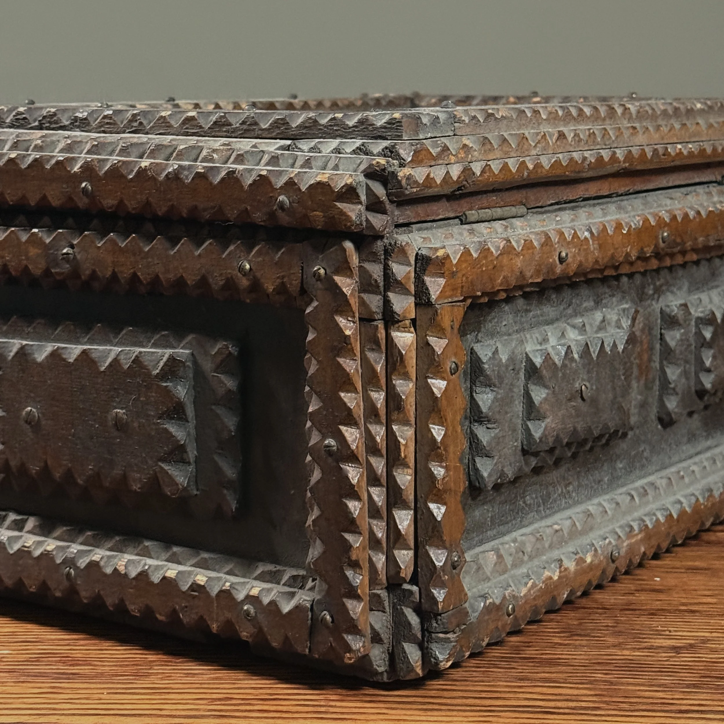Side profile of the chest, highlighting the recessed panels and stacked construction.