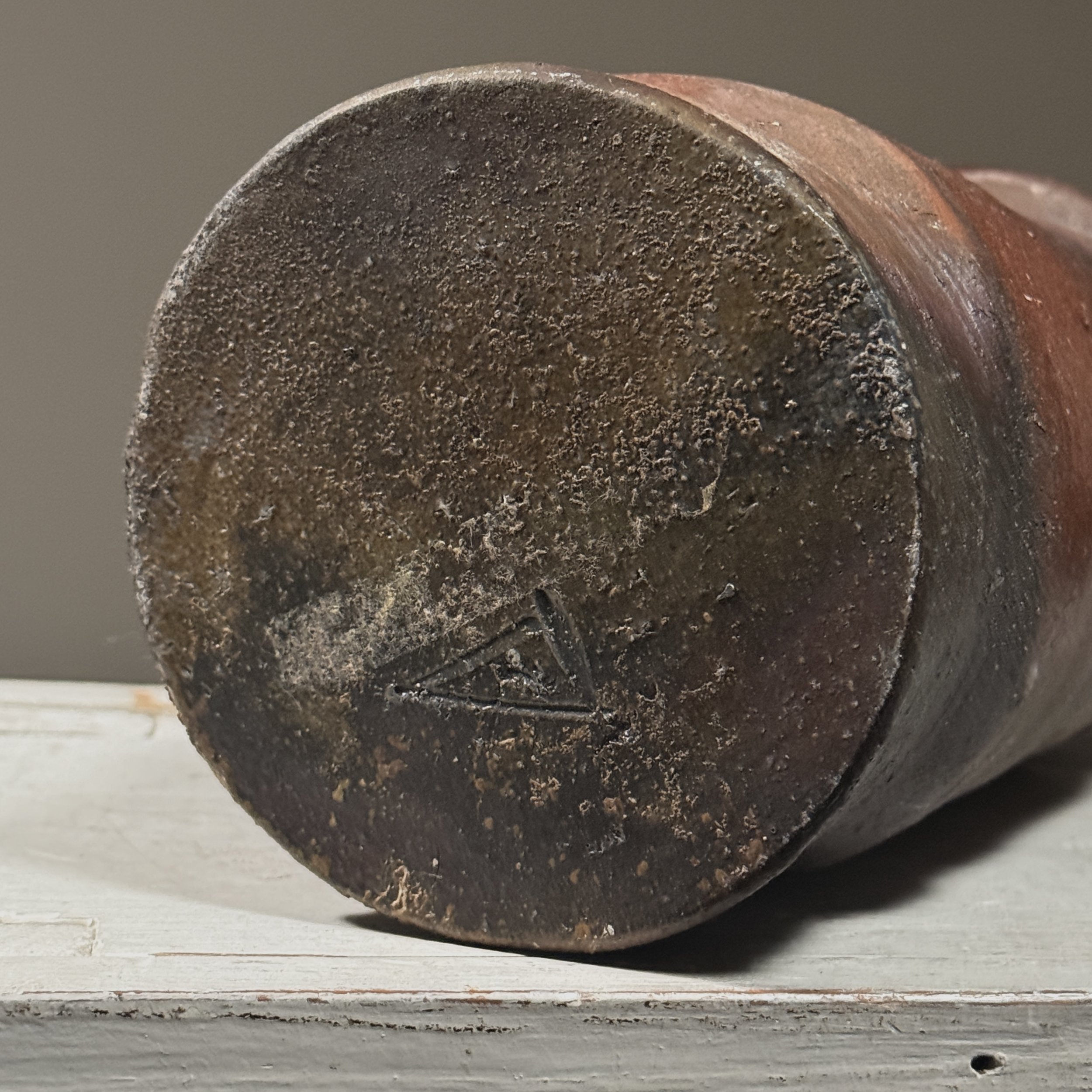 Bottom of vessel. Artist's cypher signature visible.