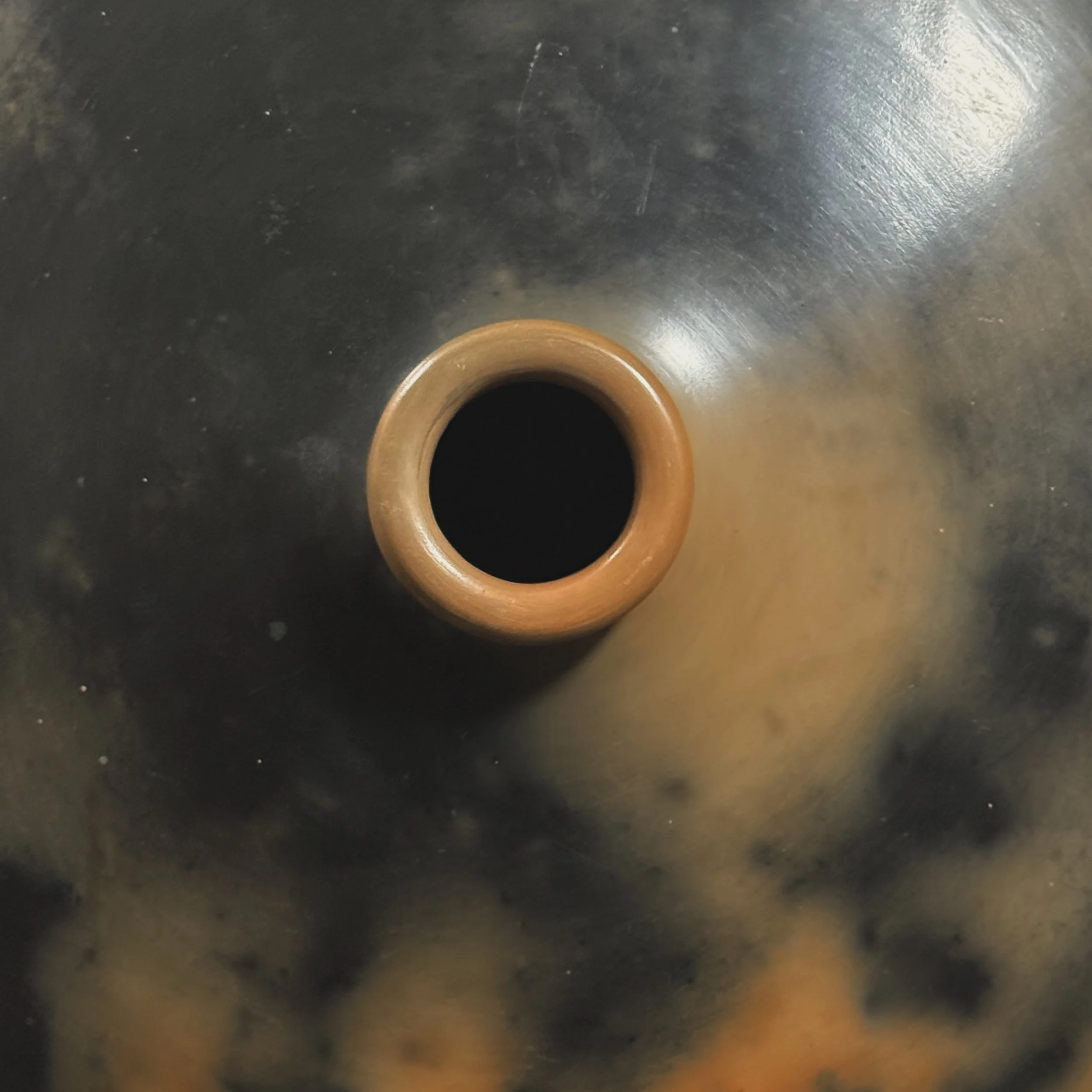 Short-necked organic modern vessel showing swirling smoke patterns.