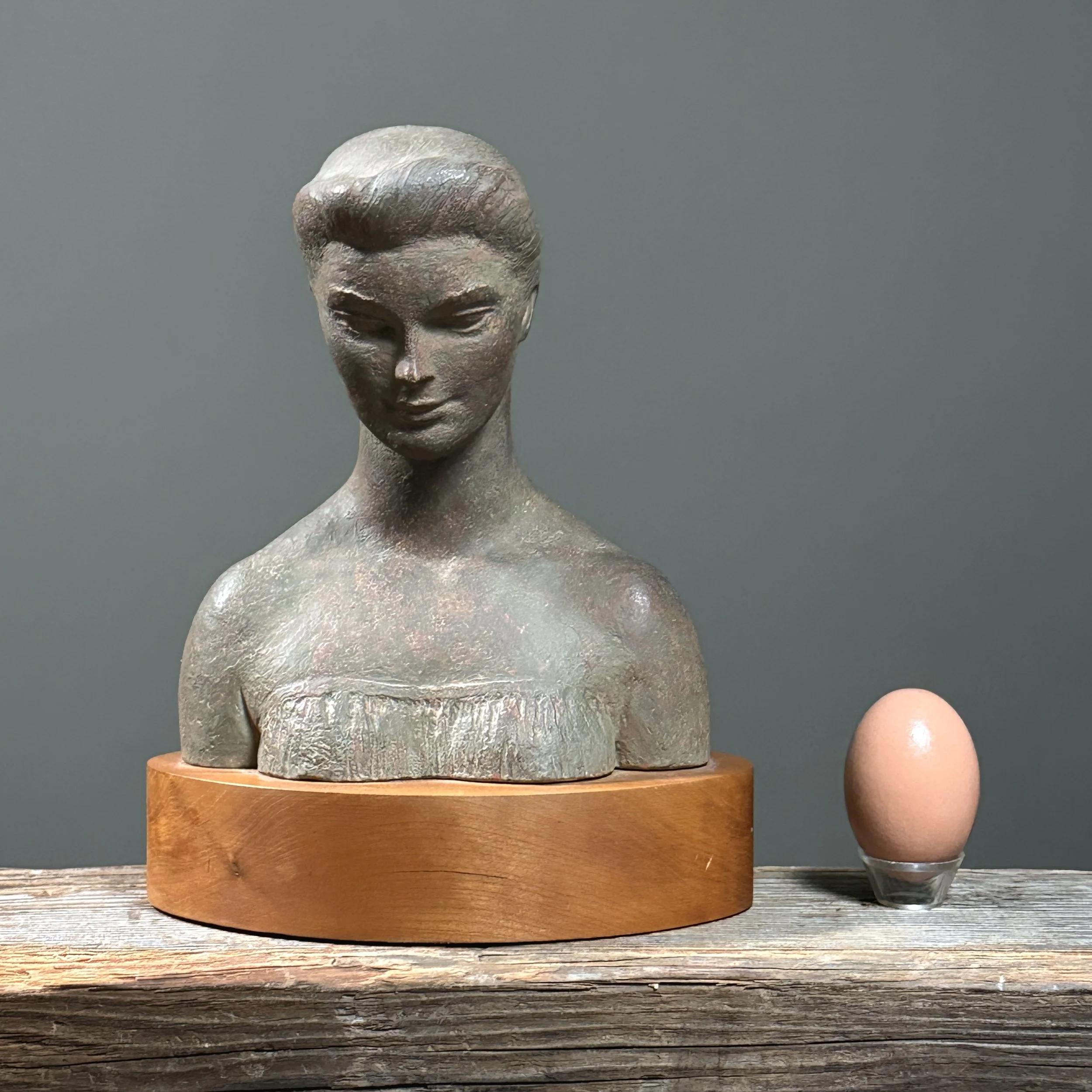 Vignette with sculpture and an egg