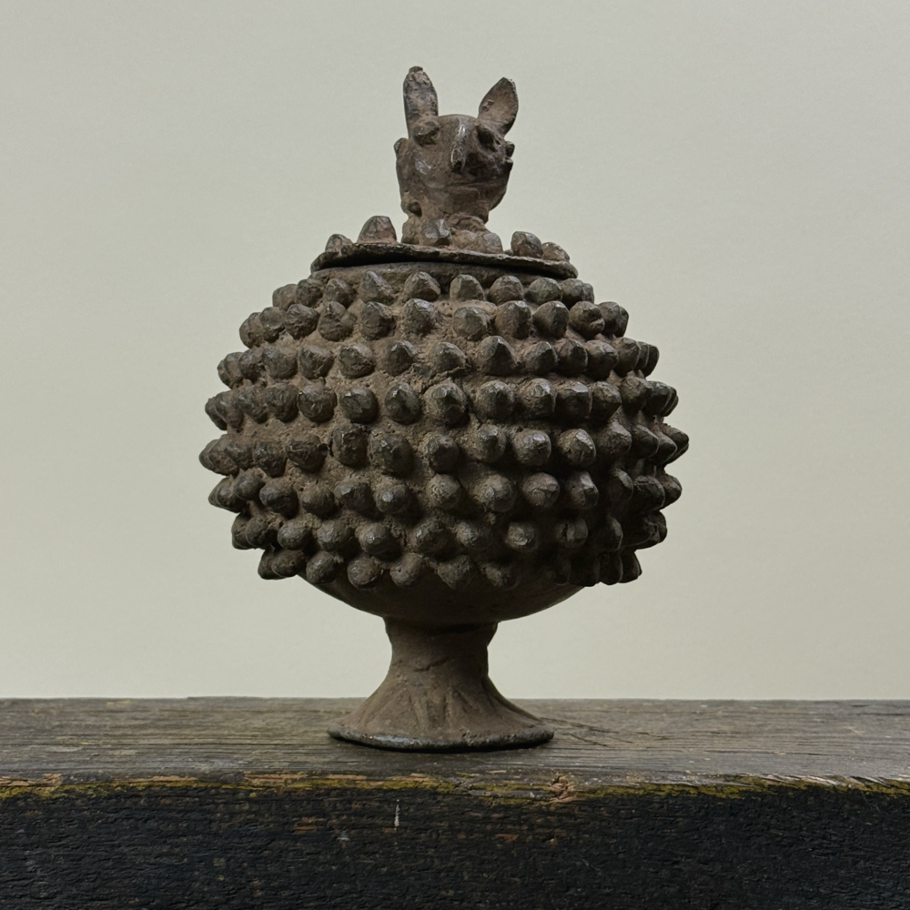 Front view of antique Lobi bronze medicine box with zoomorphic lid