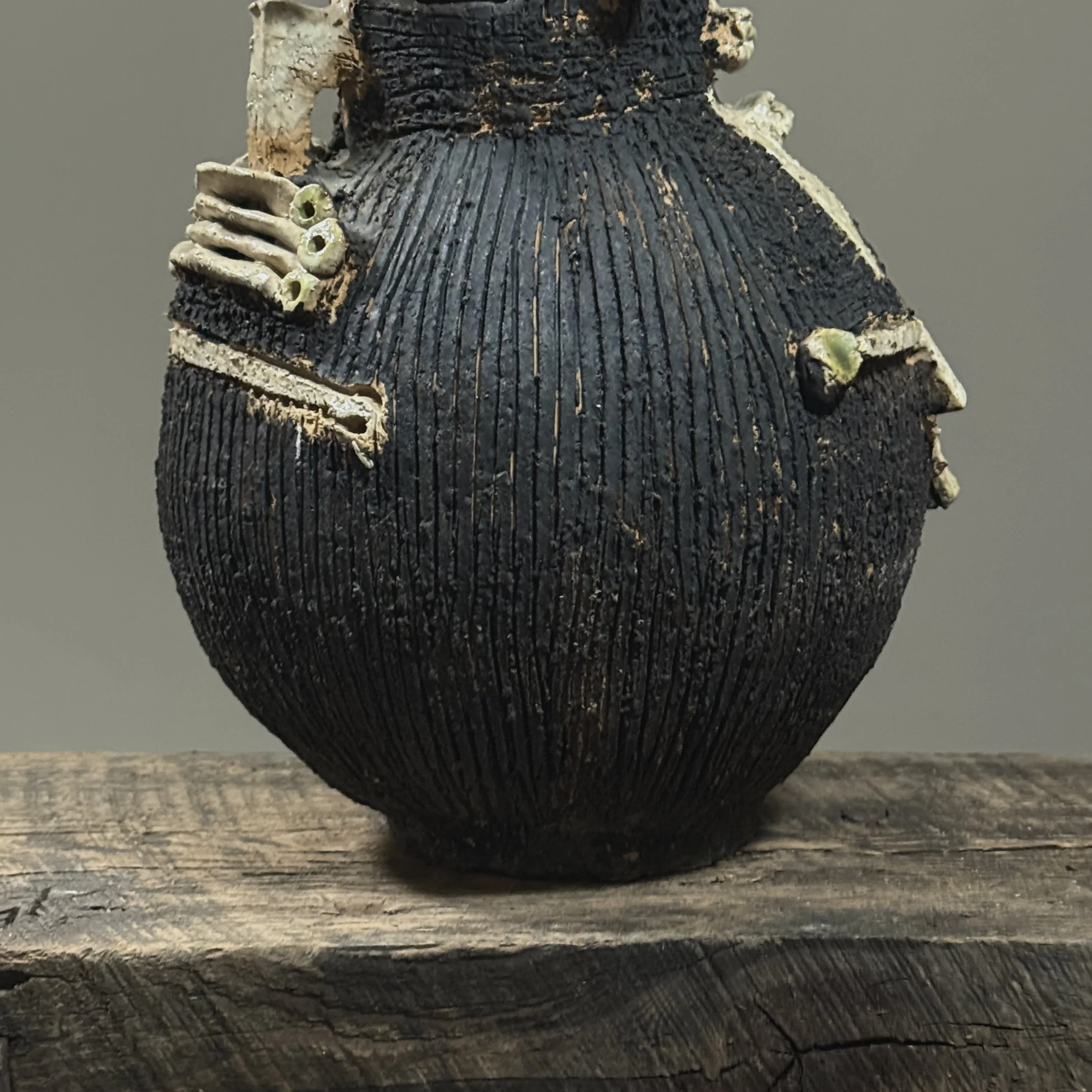 Detail of the ocular suggestion and symmetry on the skull-like figure.