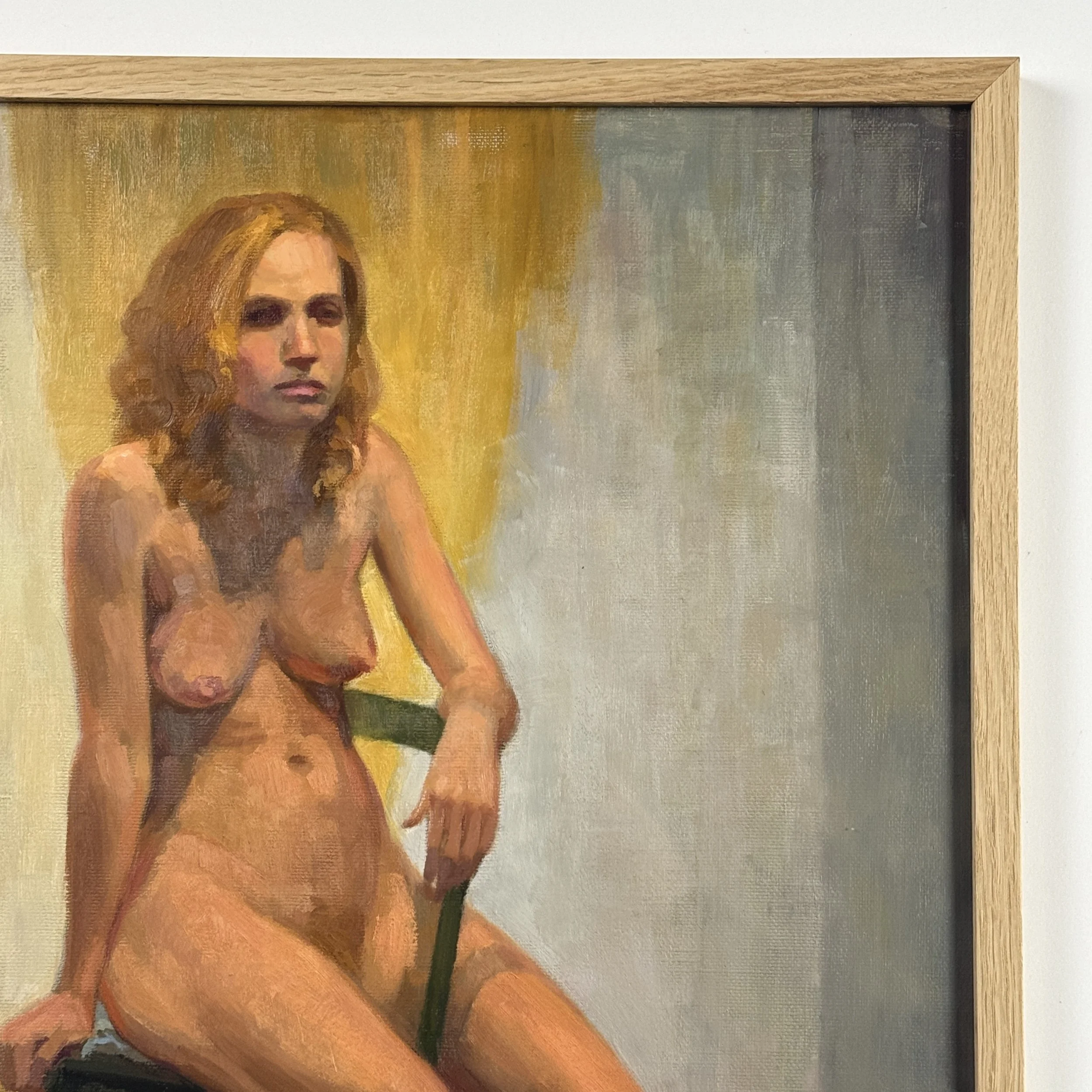 Close-up detail of the figure and fabric textures in a vintage seated nude oil painting.