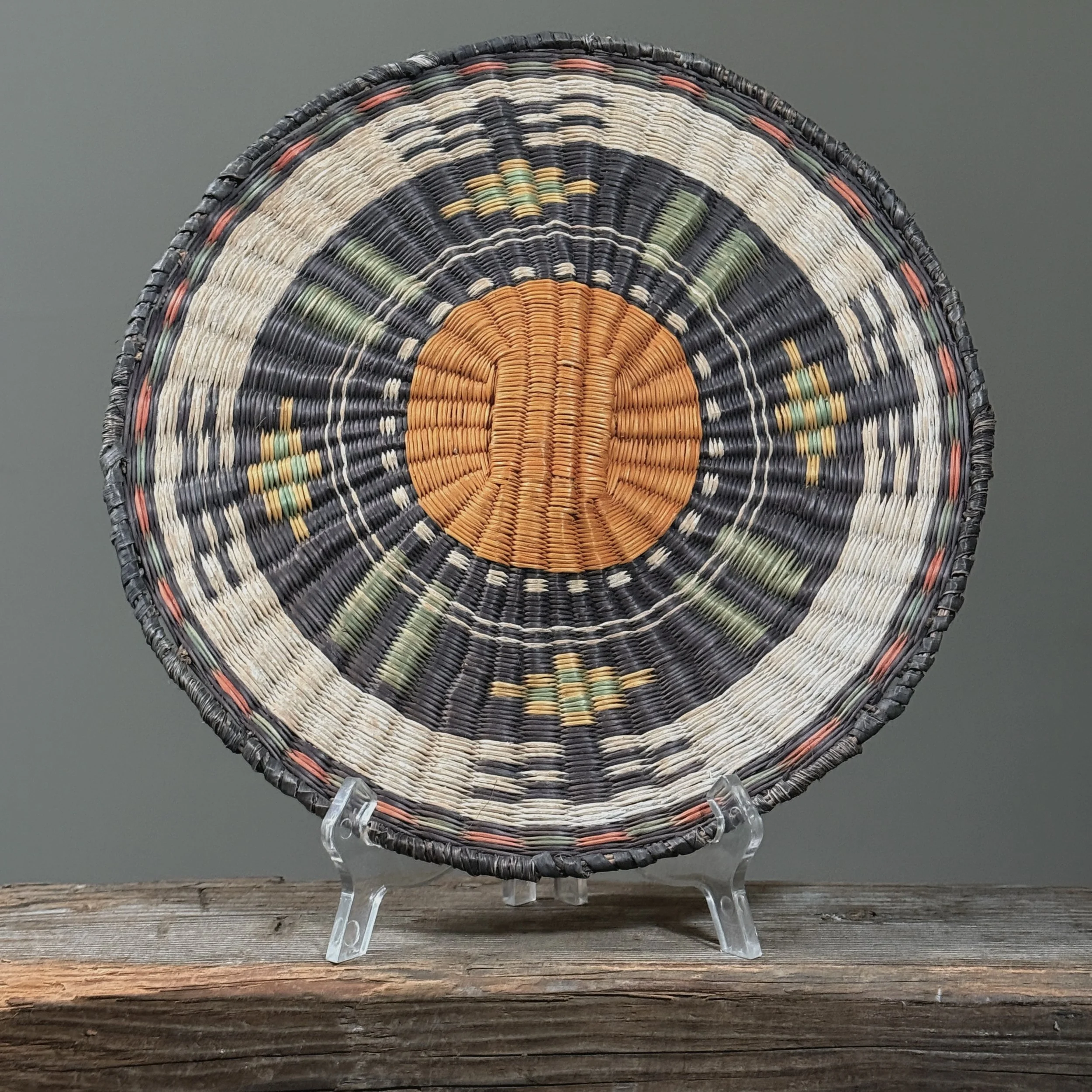 Front view of a vintage Hopi Third Mesa wicker plaque, circa 1950.
