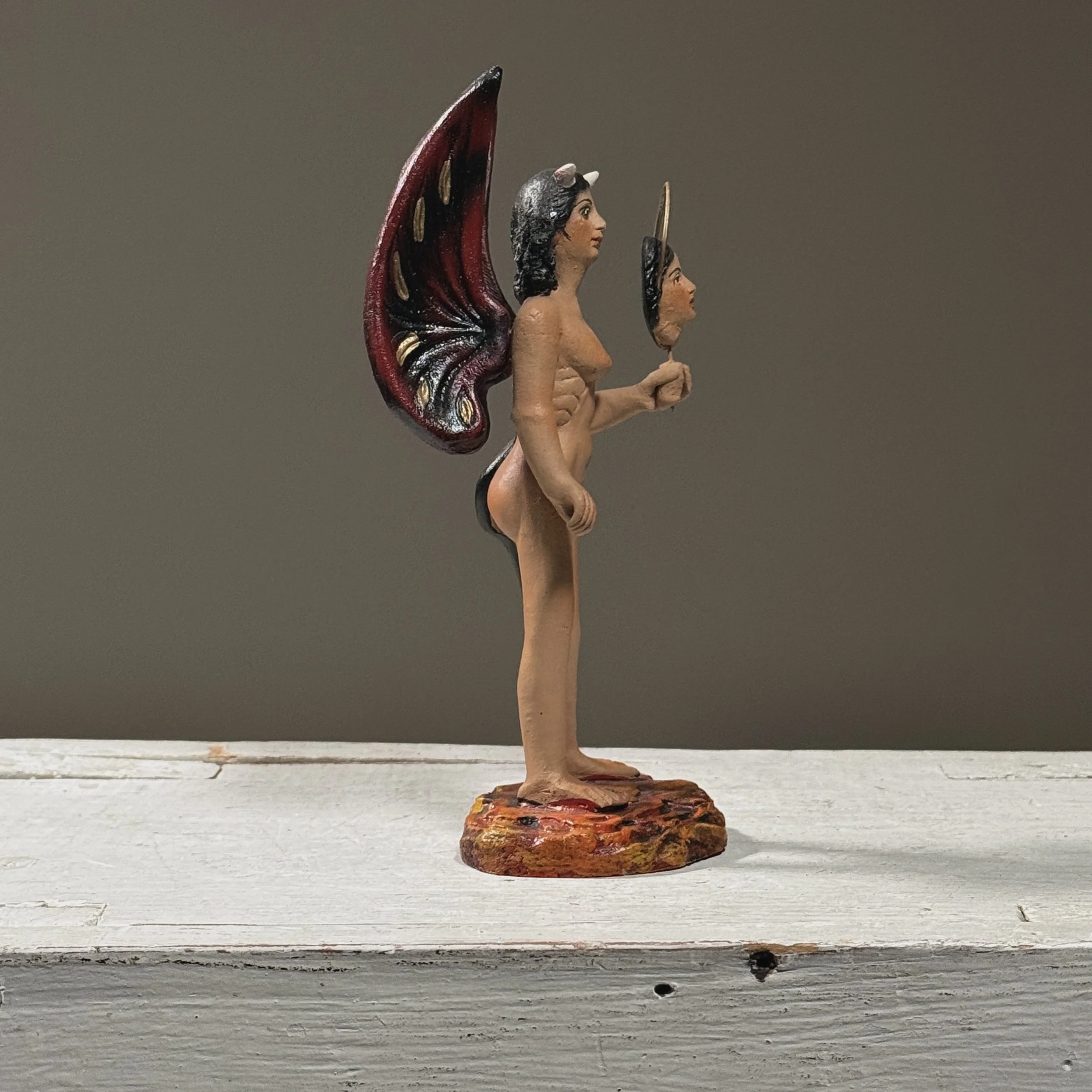 Side view. 3 inches width. Wing and arm detail visible.