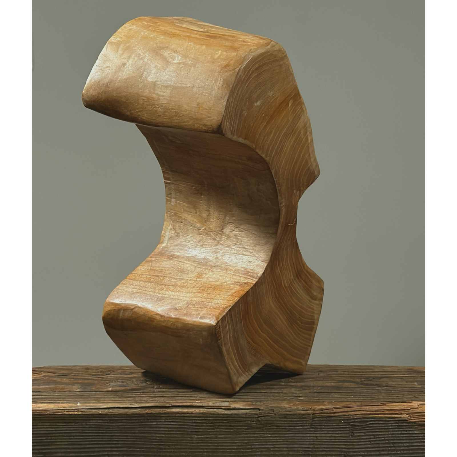Three-quarter view of vintage hand carved Danish cubist sculpture, portrait form, wood, geometric carving