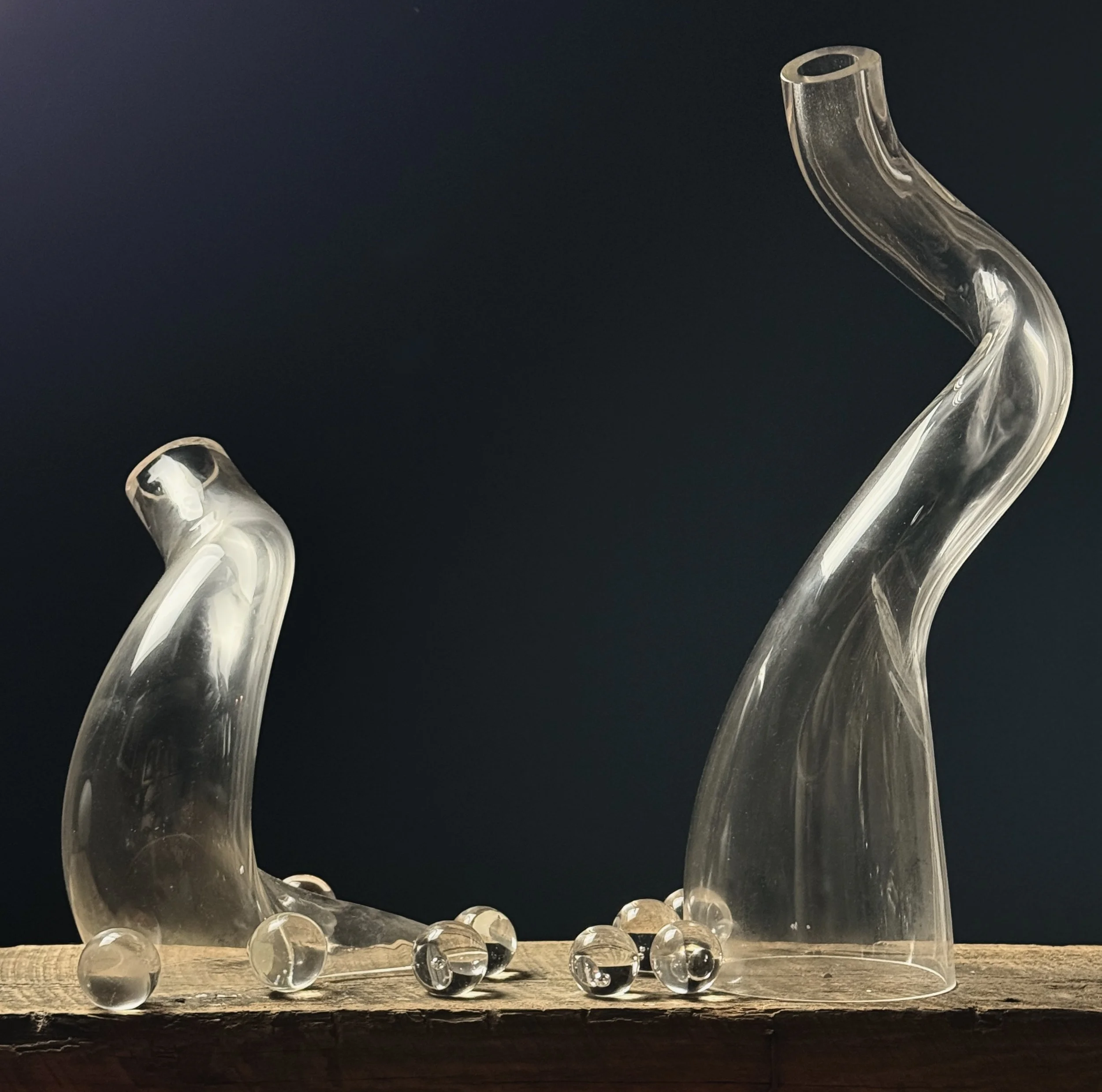 Studio glass sculpture with clear hand-blown elements and attached spheres