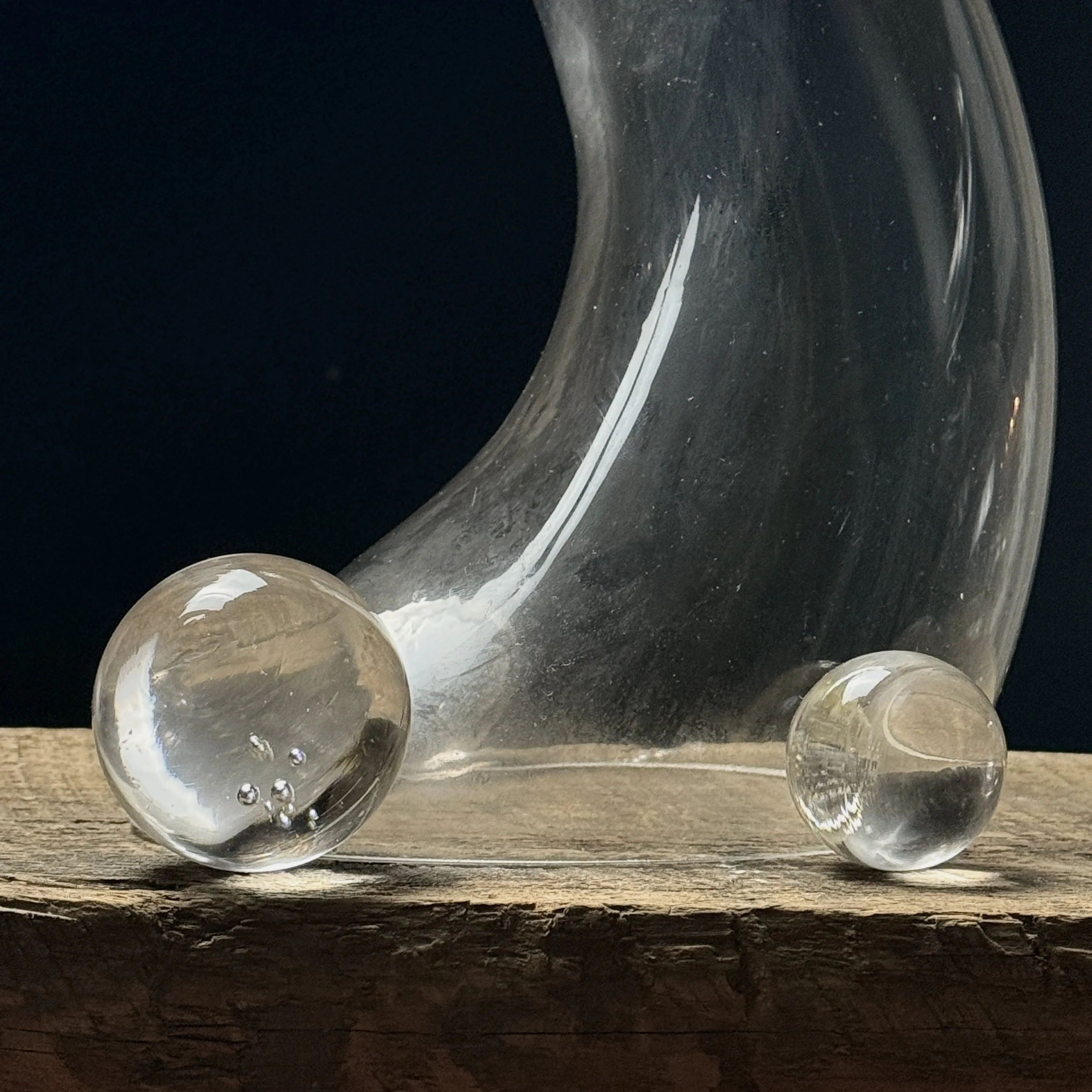 Close-up of delicate glass spheres attached to main sculptural form