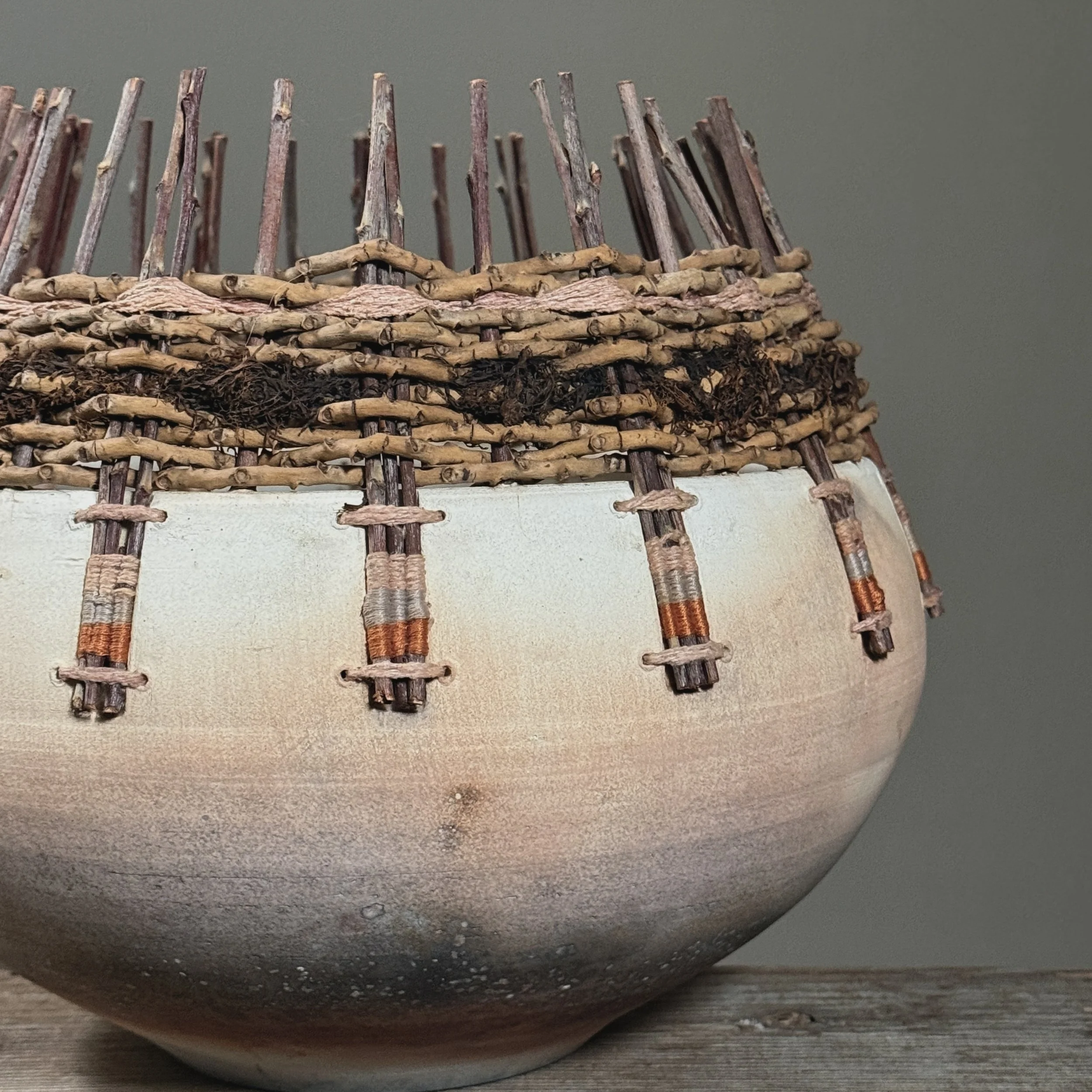 Mixed media raku ceramic and fiber vessel