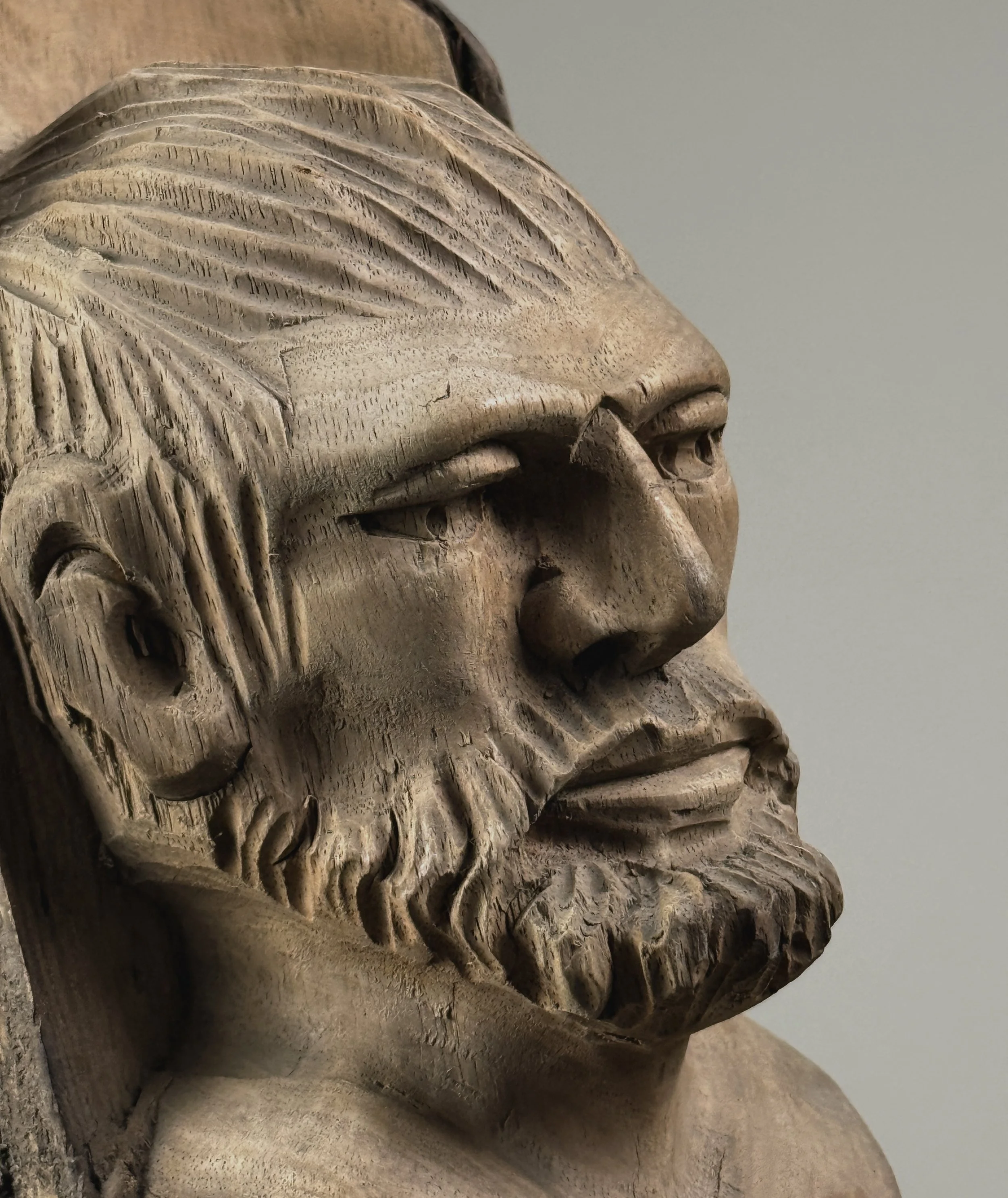 Vintage hand-carved folk art portrait of a bearded man sculpture