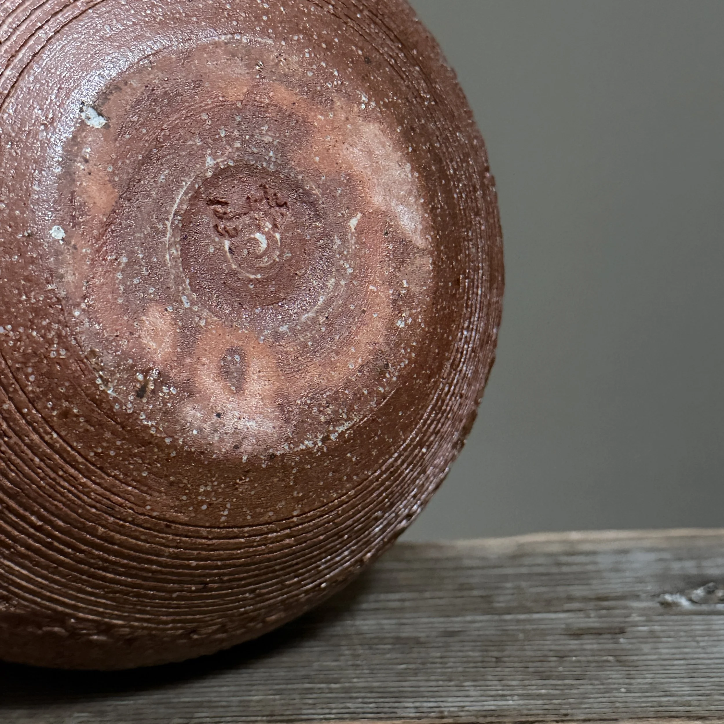 View of the vase's base showing the artist's signature.