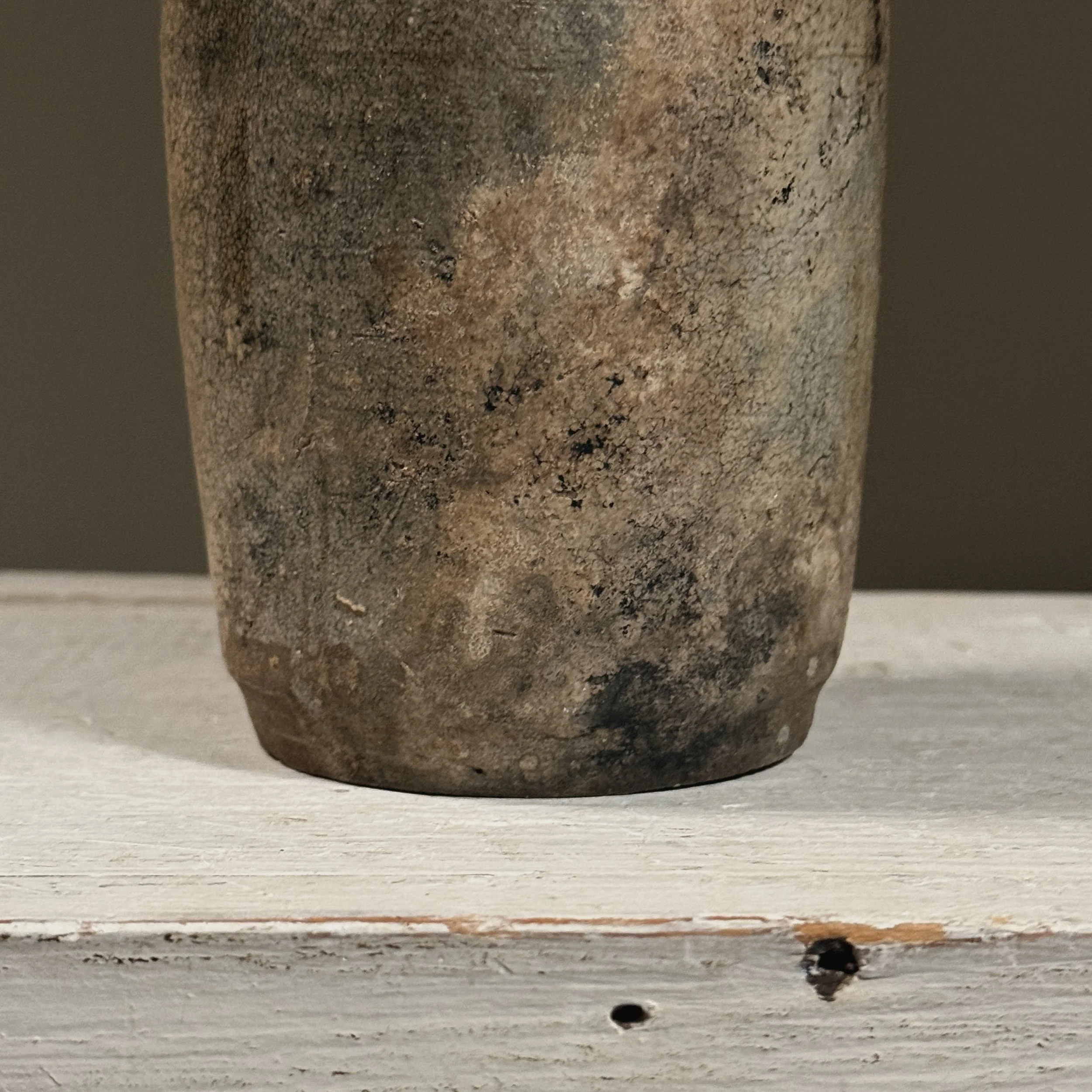 View of the base, showing unglazed foot and exposed clay body.