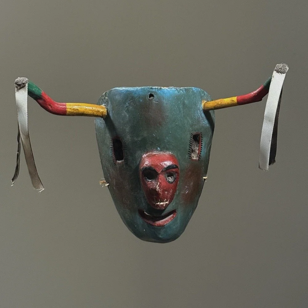 Antique Mexican folk art hand-carved bull mask front view