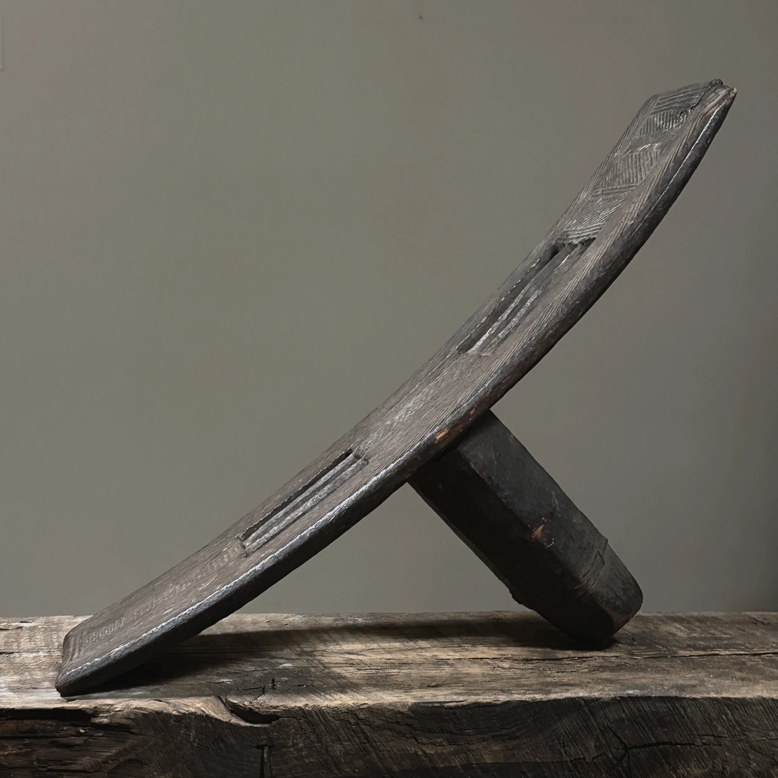 Ngombe backrest with etched geometric pattern