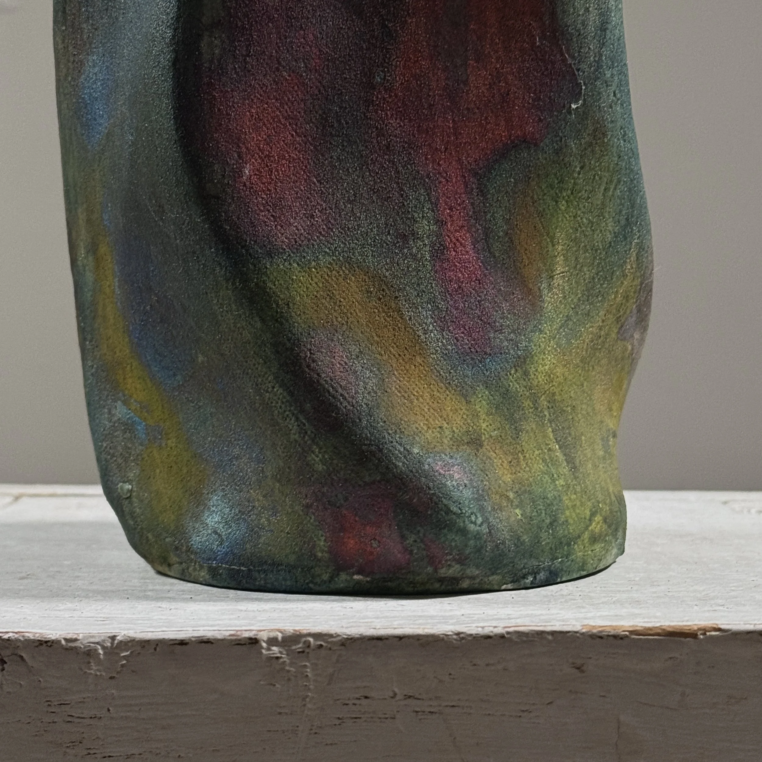 Metallic glaze detail, blackware vessel, red yellow blue accents