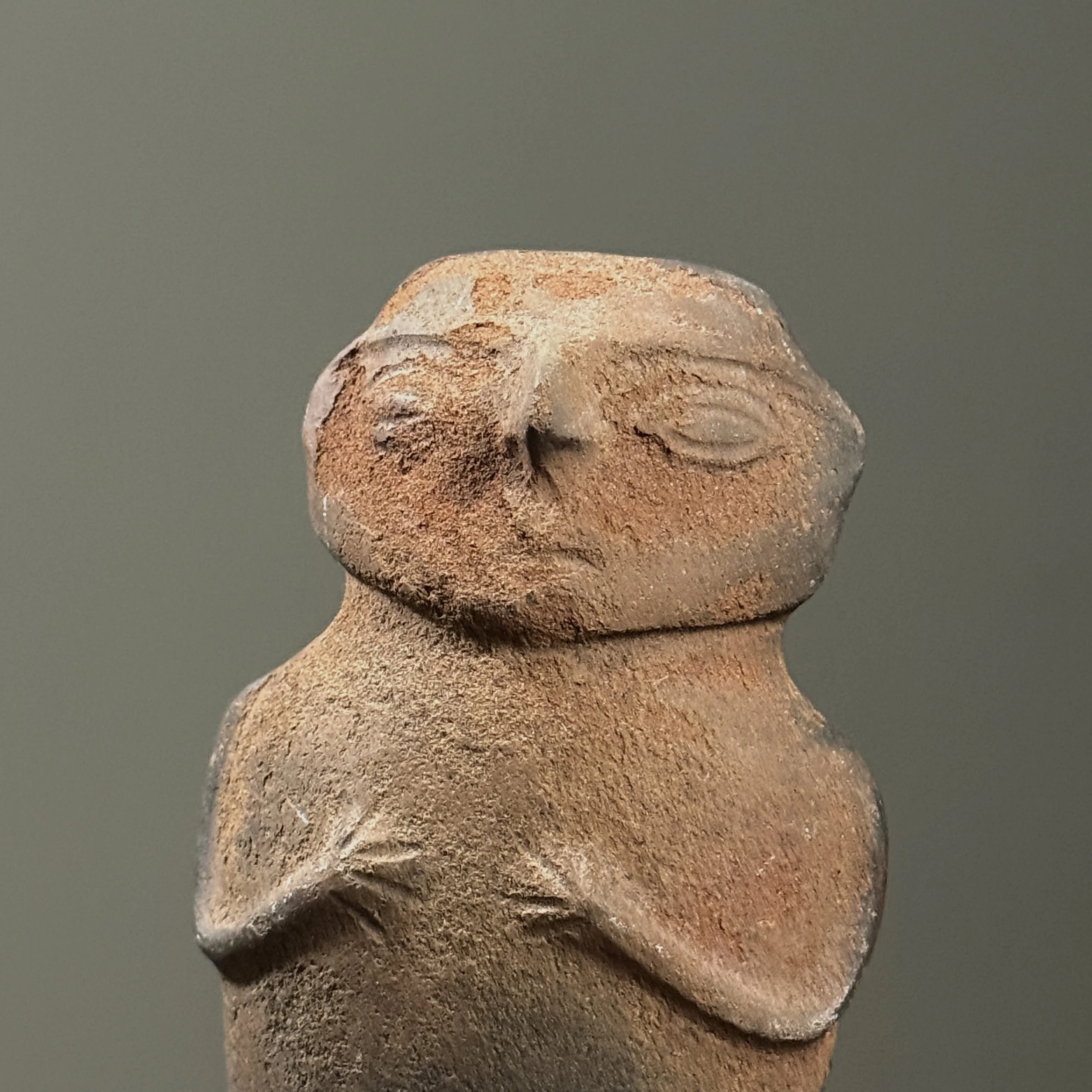 Front view of rattle. Figurative form. Wood fired clay surface.