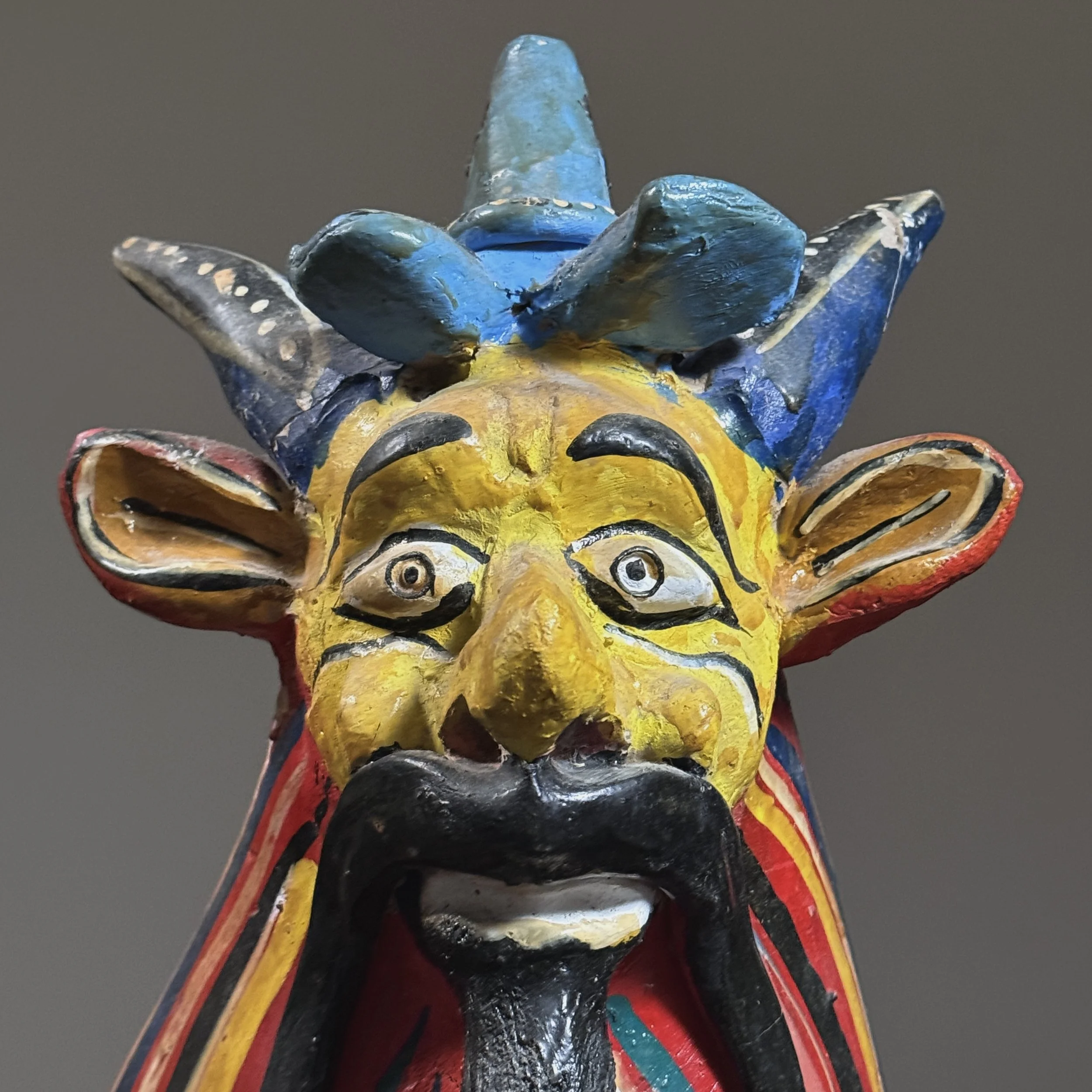 Close-up of the monster's face and hand-painted details by the celebrated Jalisco ceramicist