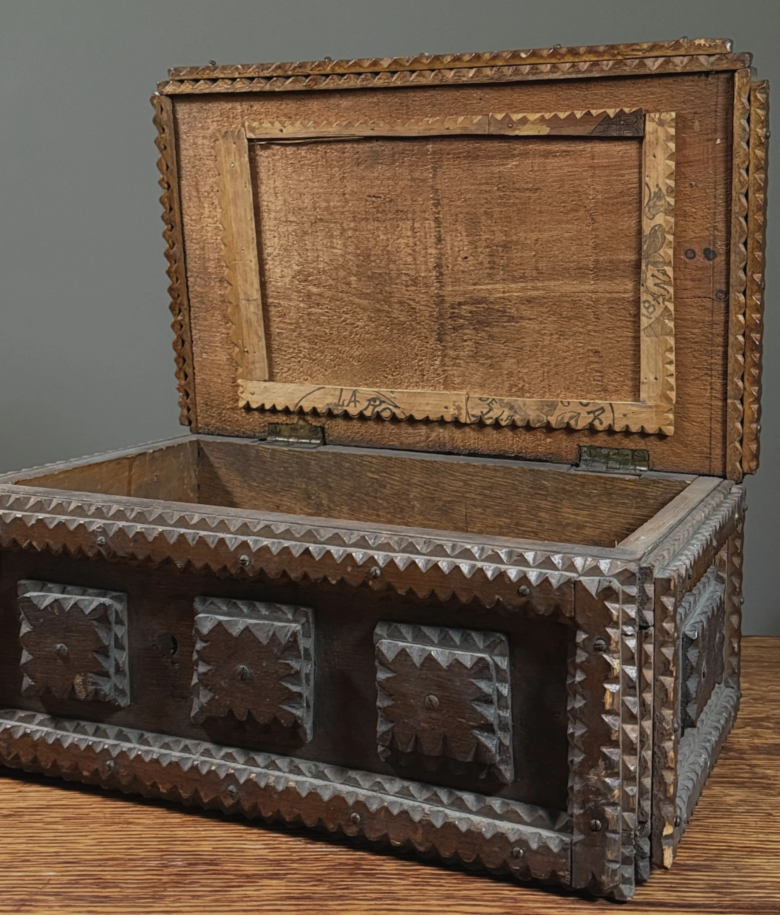 View of the chest's interior, showing its unfinished storage space.