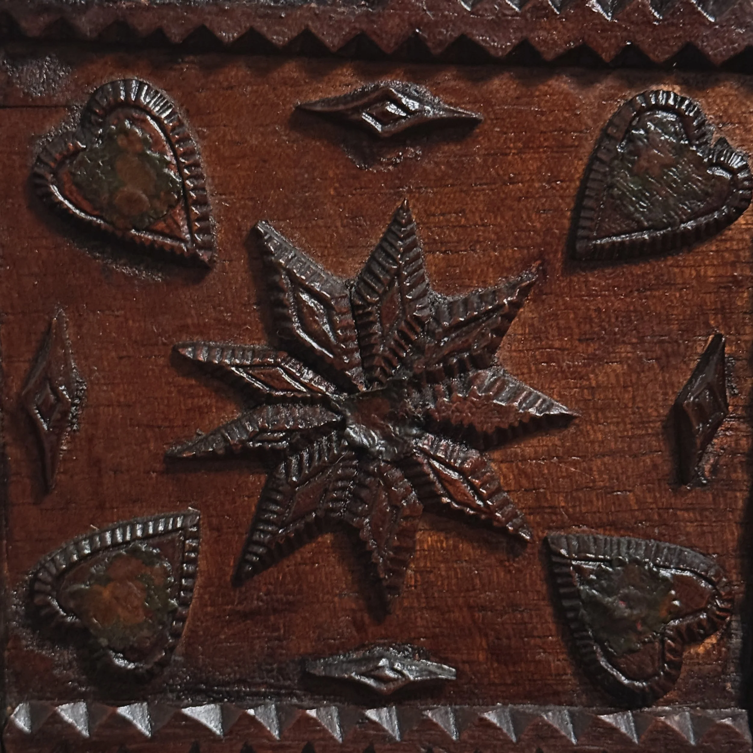 Close-up of applied wooden ornament On side panel