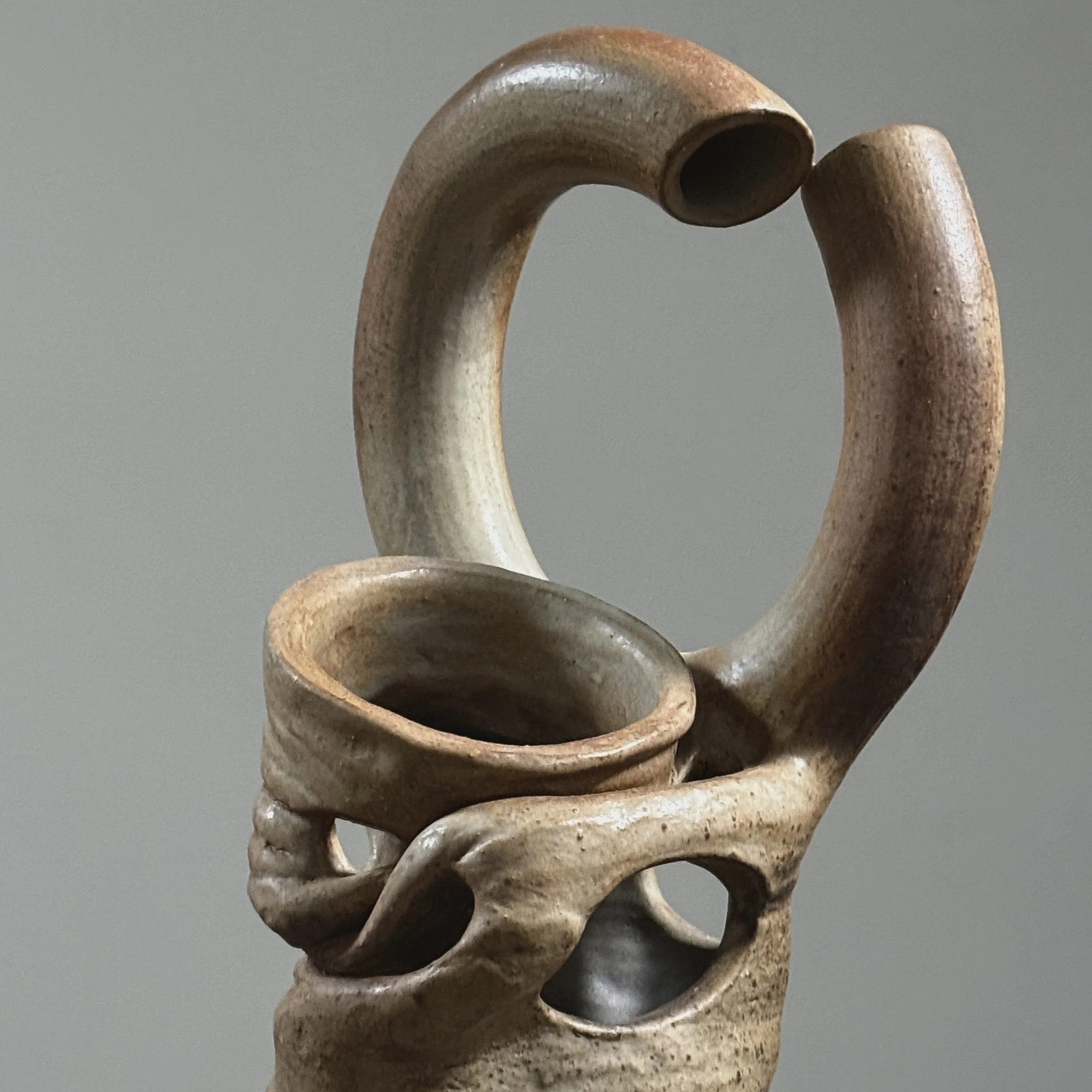 Broken circle handle detail, deconstructed ceramic vase