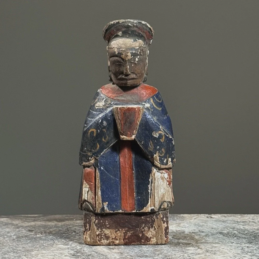 Front view of a Qing Dynasty polychrome gilt wooden deity figure.