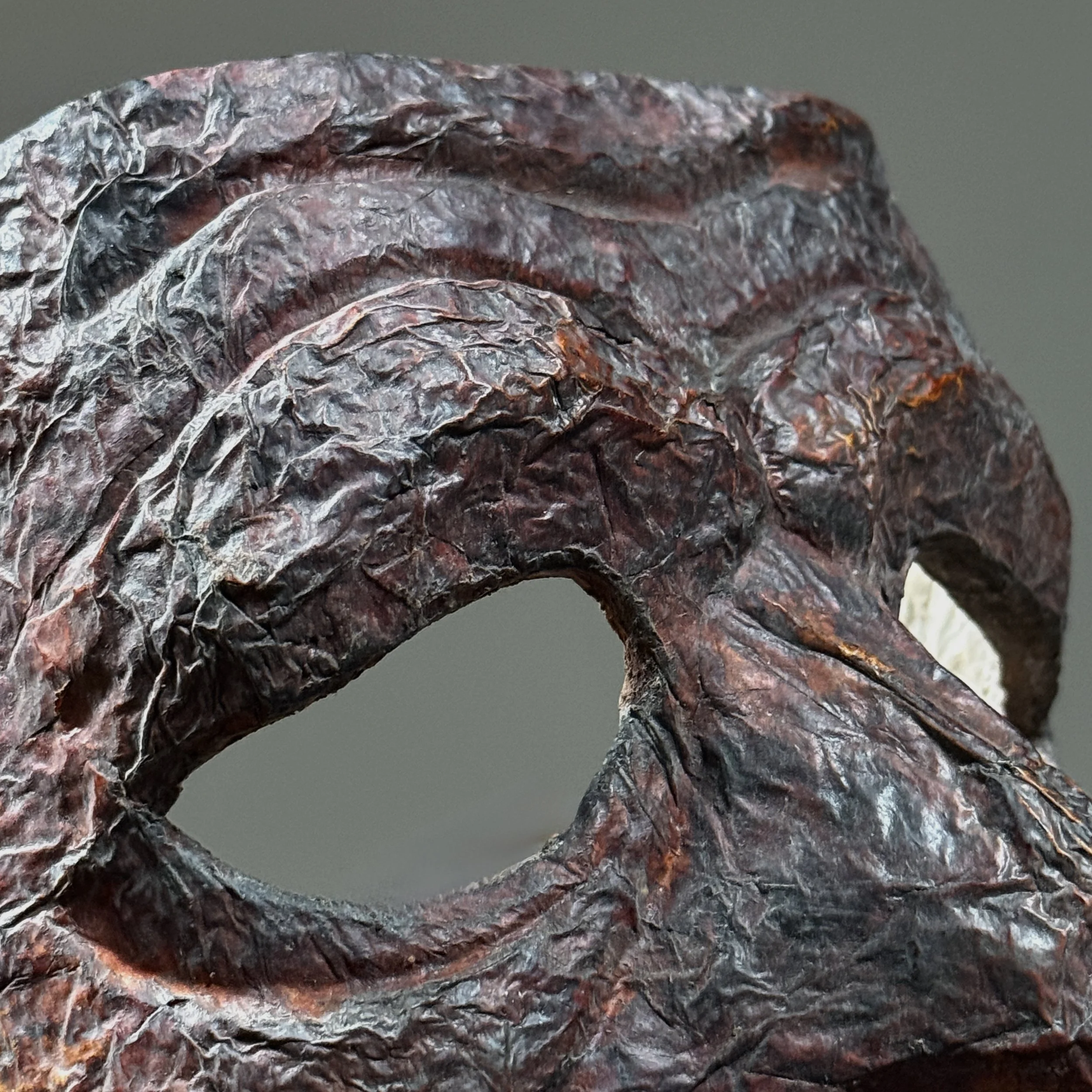 Detail of edge wear and minor pigment loss.