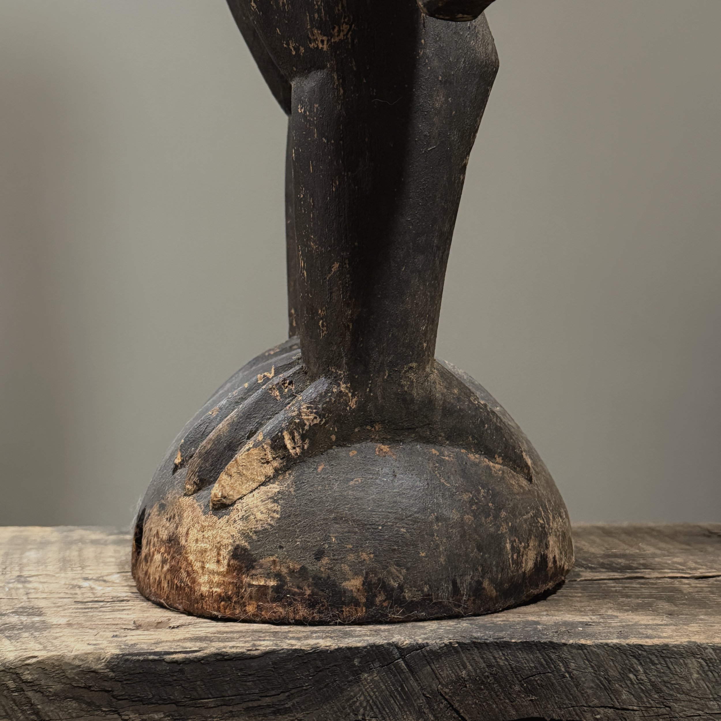 Base detail showing carved spherical perch