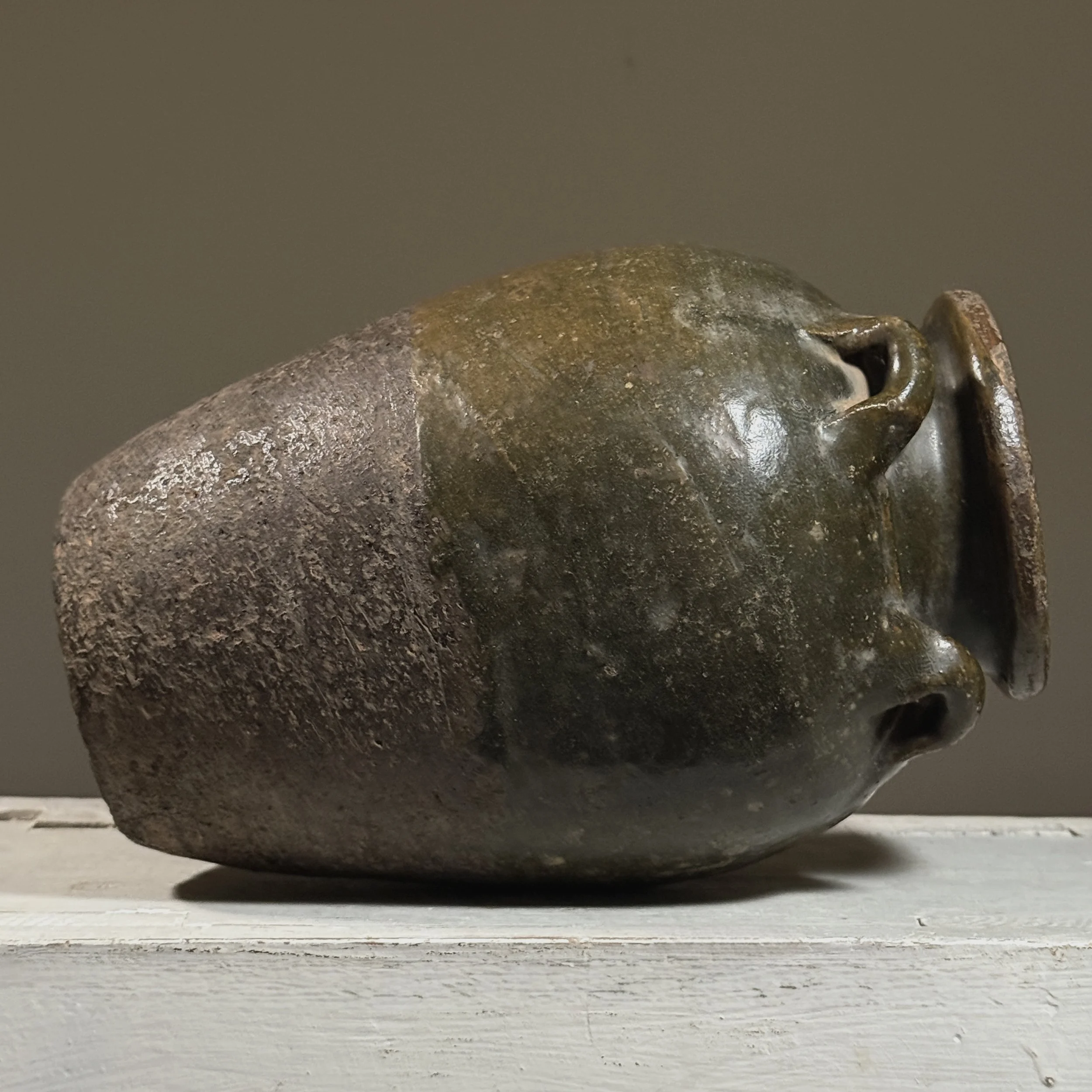 Side profile of the jar showing its ovoid body and short neck.